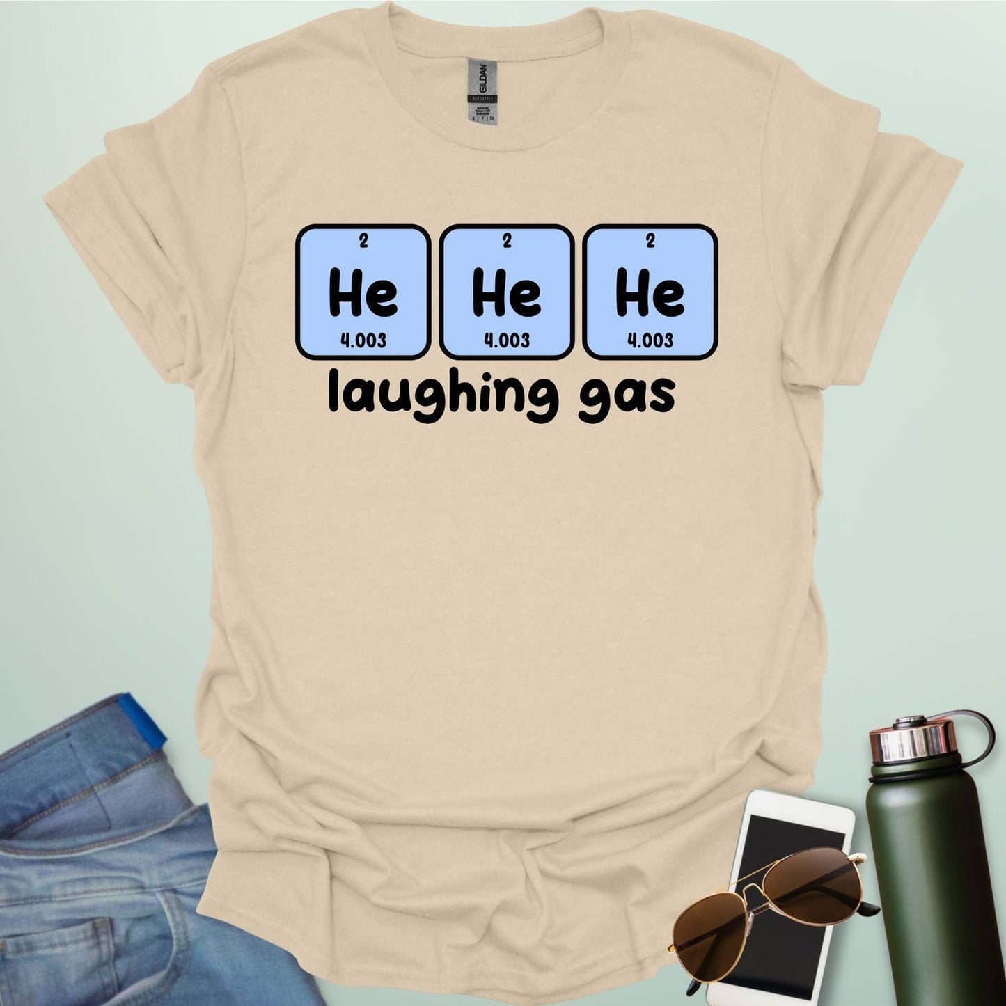 Three periodic table element boxes showing 'He' for Helium, with the text 'laughing gas' below.