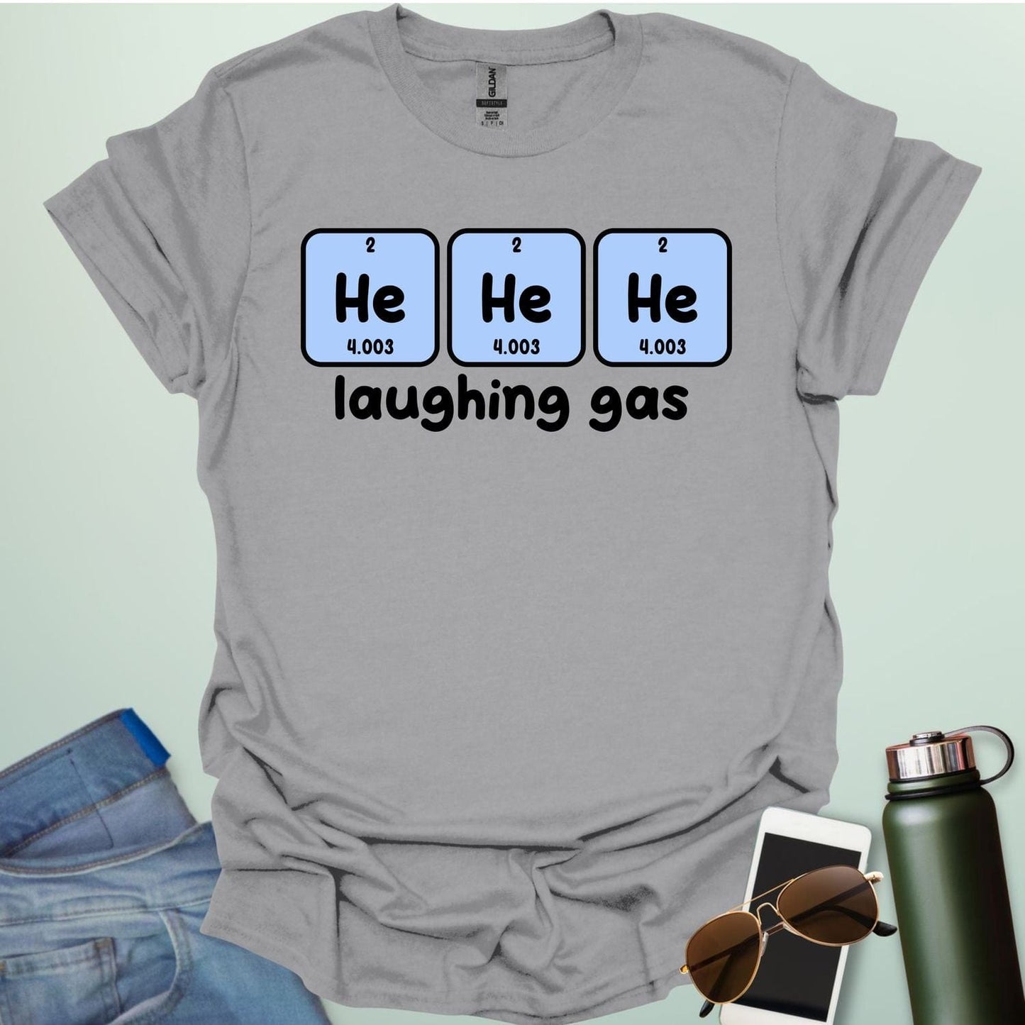 Three periodic table element boxes showing 'He' for Helium, with the text 'laughing gas' below.