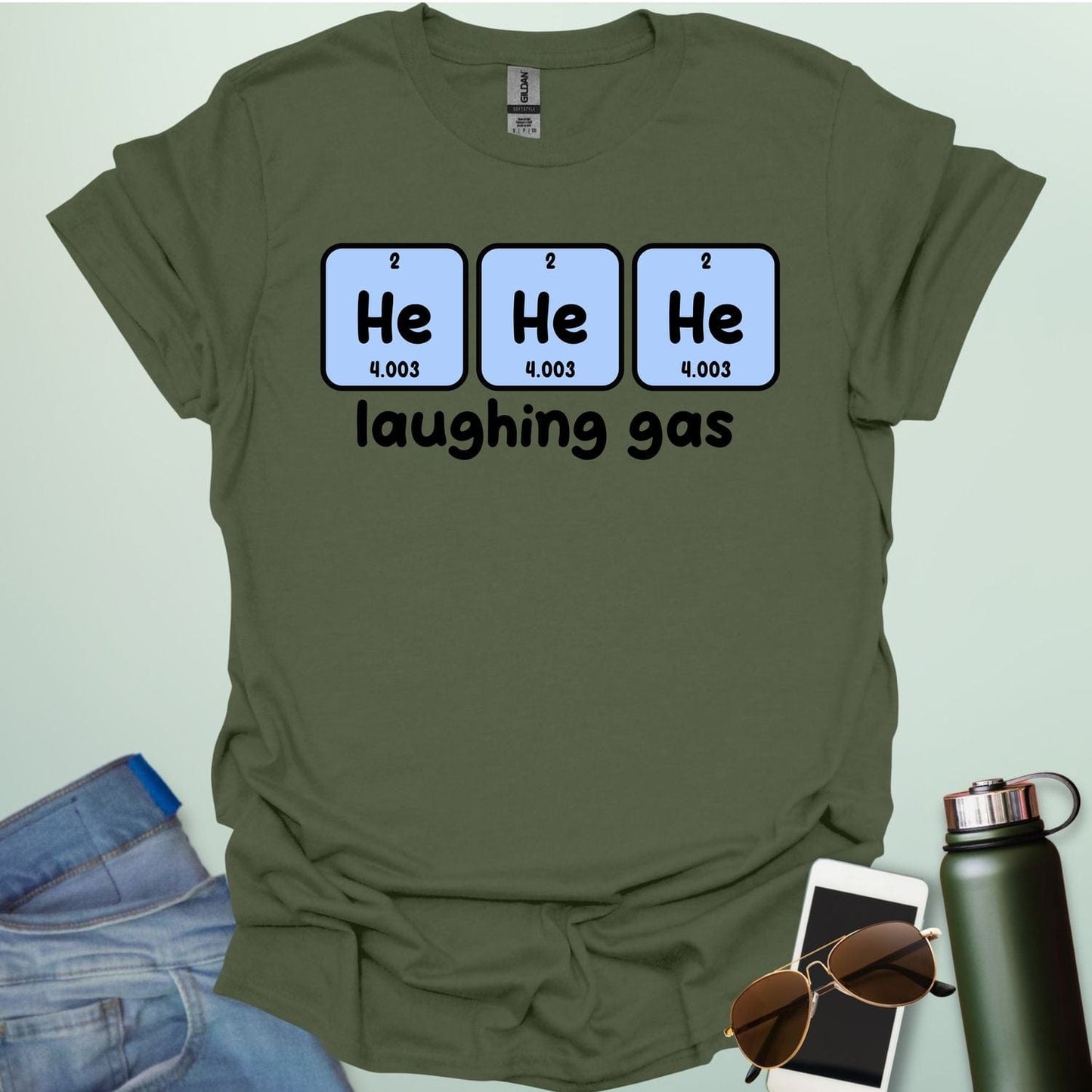Three periodic table element boxes showing 'He' for Helium, with the text 'laughing gas' below.