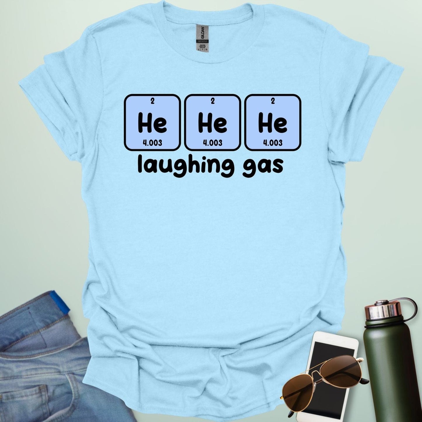 Three periodic table element boxes showing 'He' for Helium, with the text 'laughing gas' below.