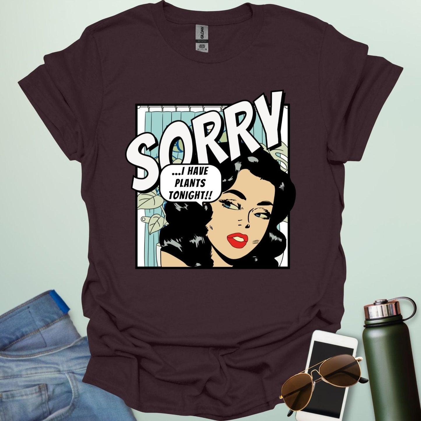 A dark chocolate t-shirt with a retro comic-book style illustration of a woman and the text 'SORRY ...I HAVE PLANTS TONIGHT!!'