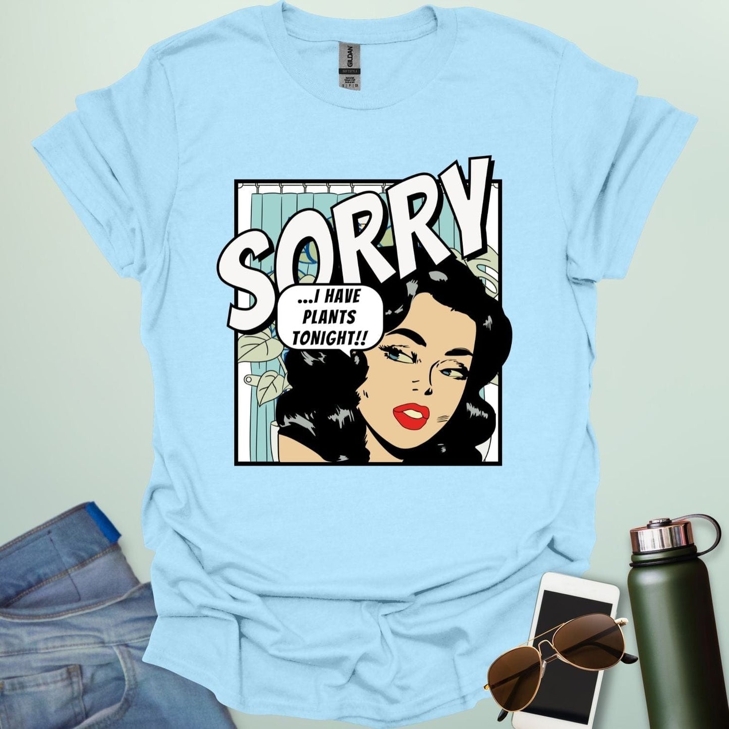 A light blue t-shirt with a retro comic-book style illustration of a woman and the text 'SORRY ...I HAVE PLANTS TONIGHT!!'
