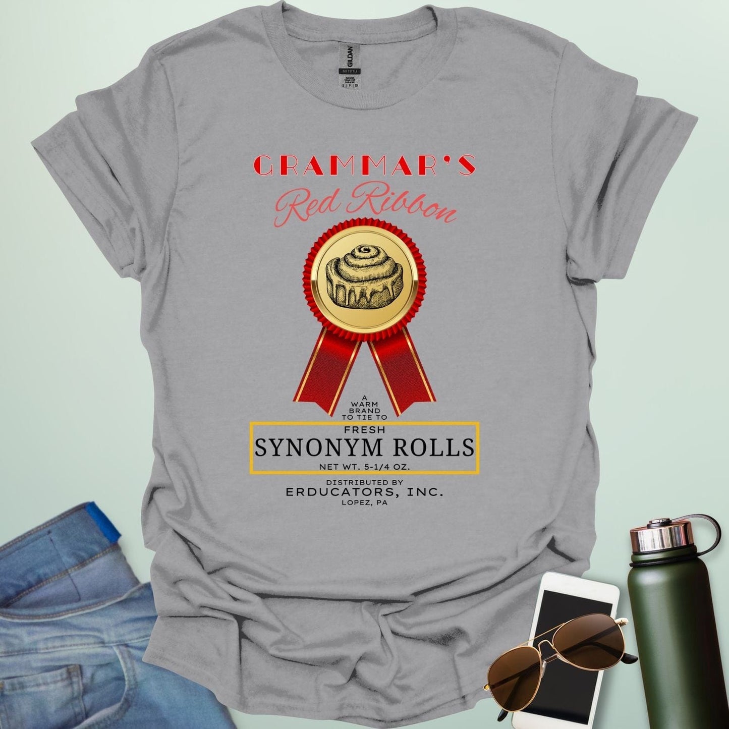 Grammar's Synonym Rolls t-shirt featuring a red ribbon award for fresh cinnamon rolls. Ideal funny gift for English teachers, writers, and grammar nerds.