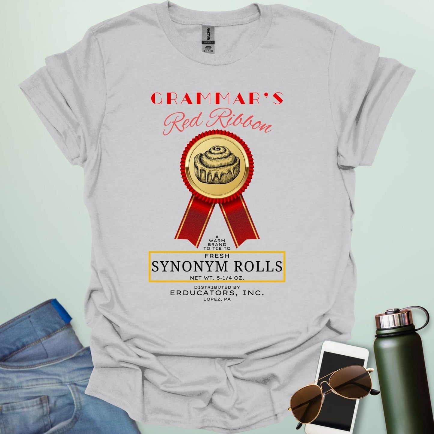 Grammar's Synonym Rolls t-shirt featuring a red ribbon award for fresh cinnamon rolls. Ideal funny gift for English teachers, writers, and grammar nerds.