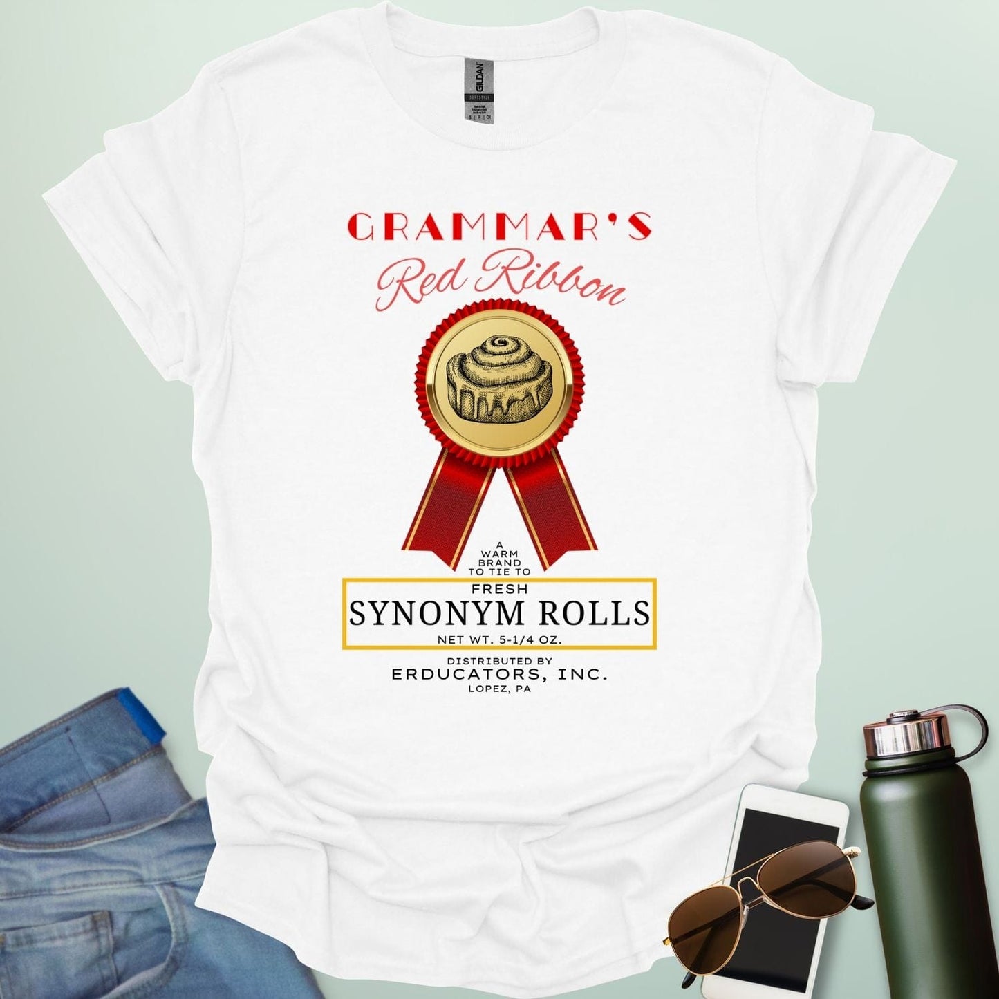 Grammar's Synonym Rolls t-shirt featuring a red ribbon award for fresh cinnamon rolls. Ideal funny gift for English teachers, writers, and grammar nerds.