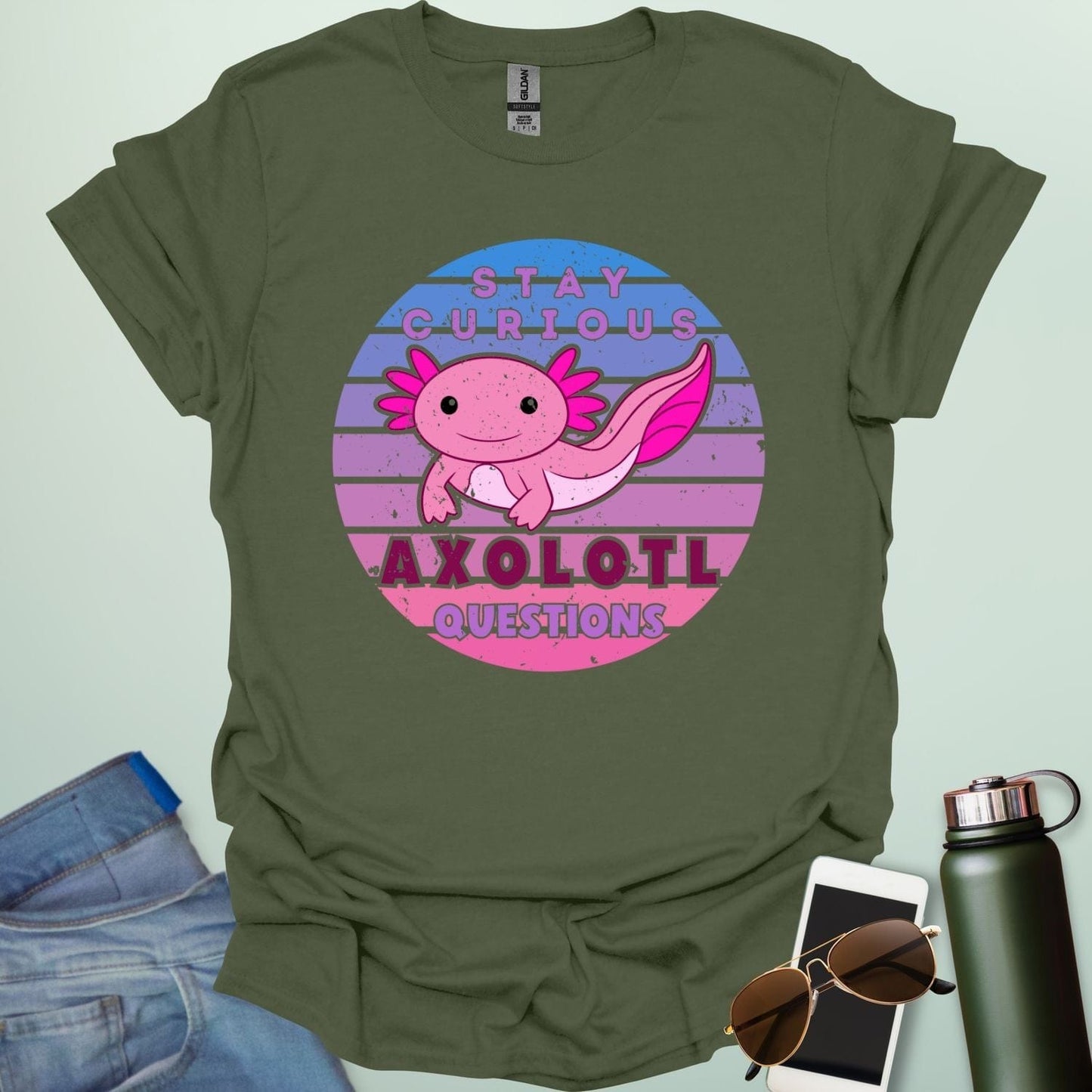 A military green t-shirt with a cute axolotl in a circular design and the text 'Stay Curious Axolotl Questions.'