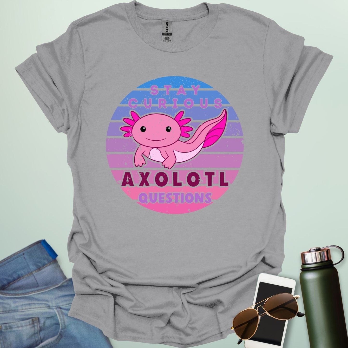 A sport grey t-shirt with a cute axolotl in a circular design and the text 'Stay Curious Axolotl Questions.'