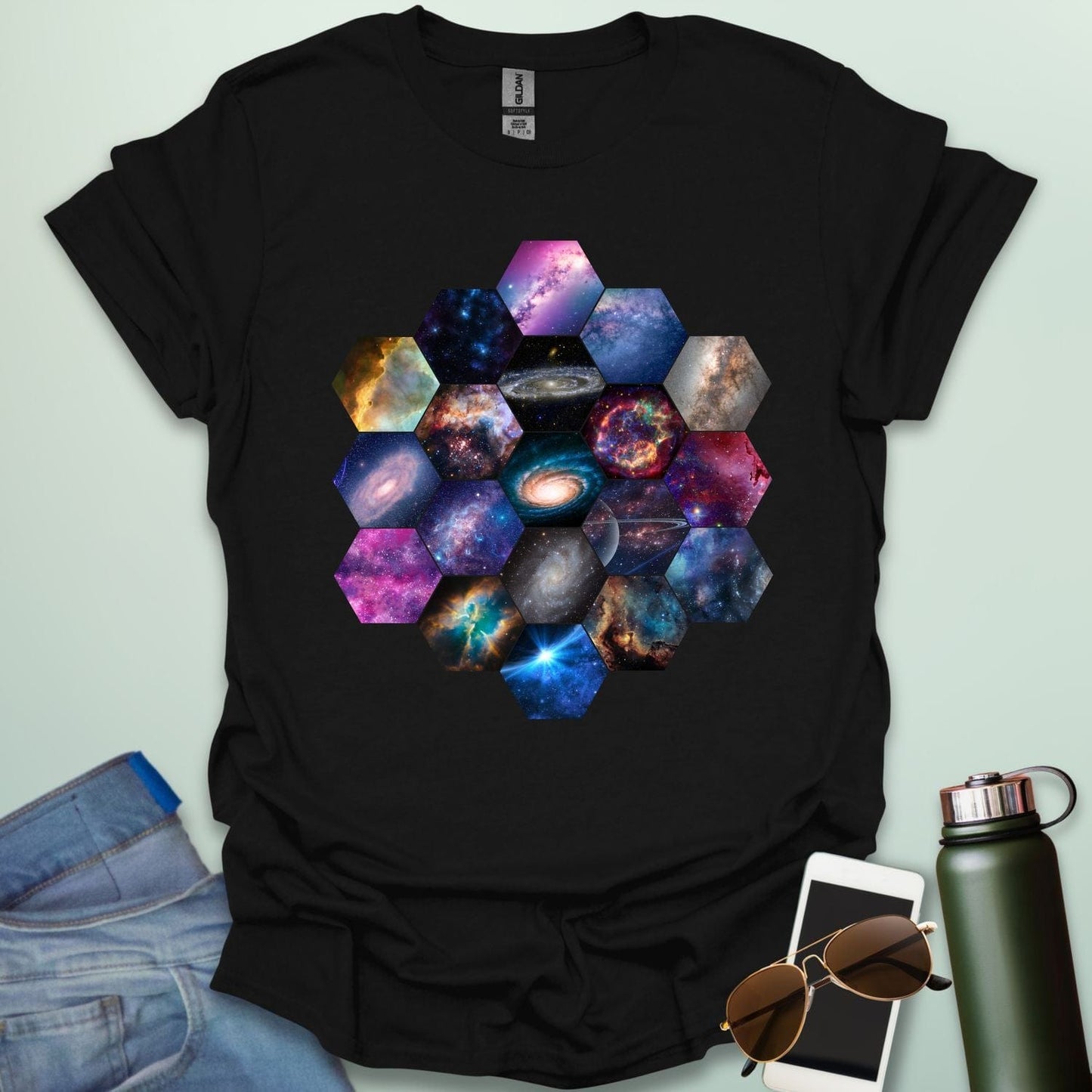 T-shirt design featuring a hexagonal pattern inspired by the James Webb Space Telescope's mirror, each hexagon filled with a different image of the cosmos.