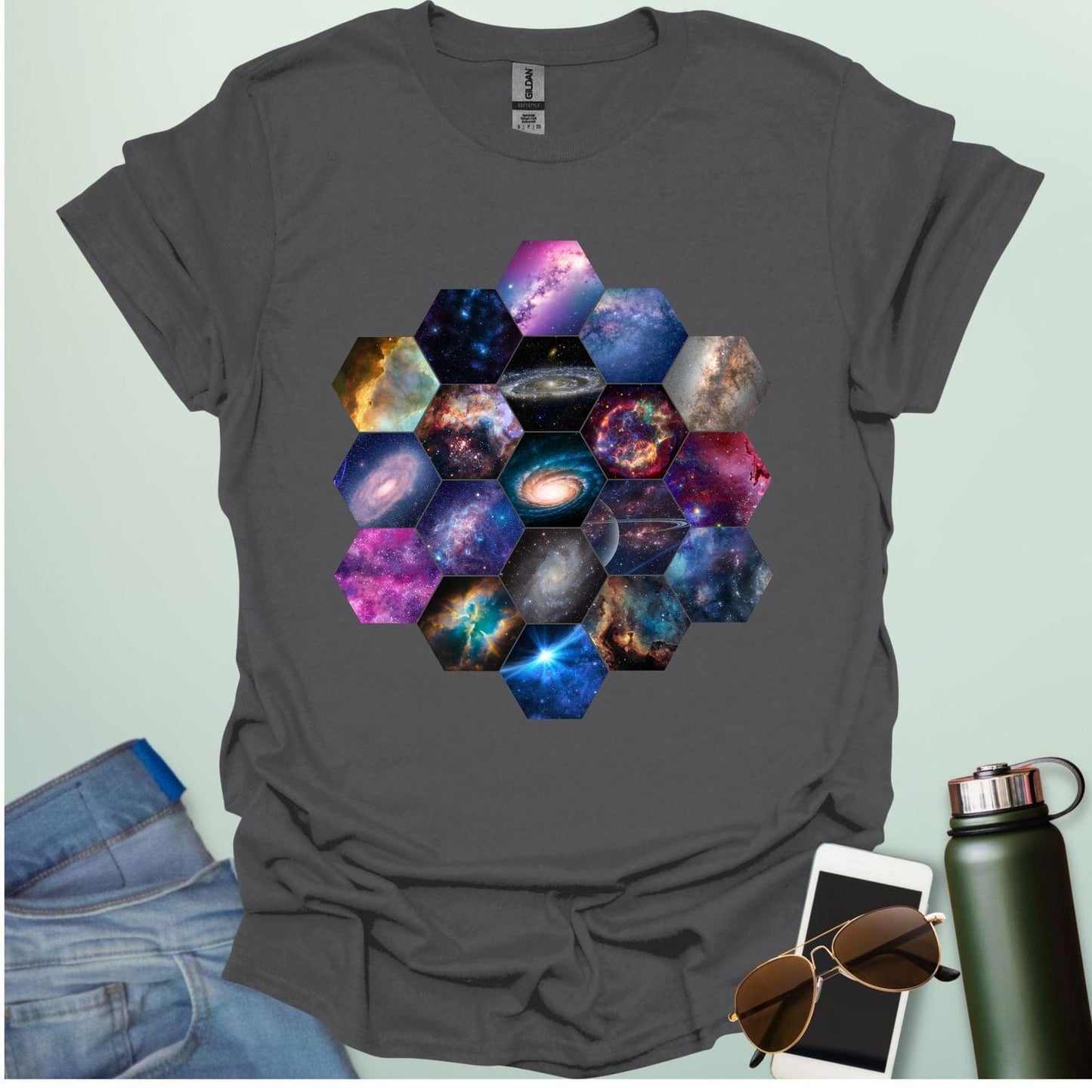 T-shirt design featuring a hexagonal pattern inspired by the James Webb Space Telescope's mirror, each hexagon filled with a different image of the cosmos.