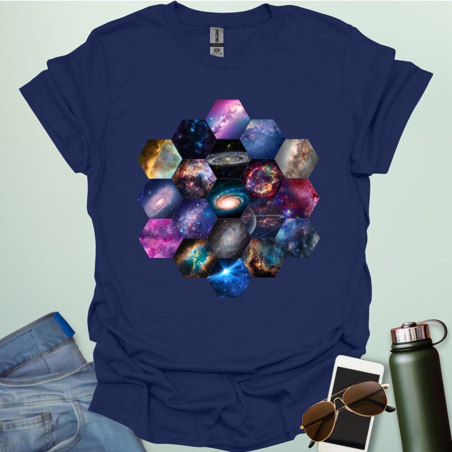 T-shirt design featuring a hexagonal pattern inspired by the James Webb Space Telescope's mirror, each hexagon filled with a different image of the cosmos.