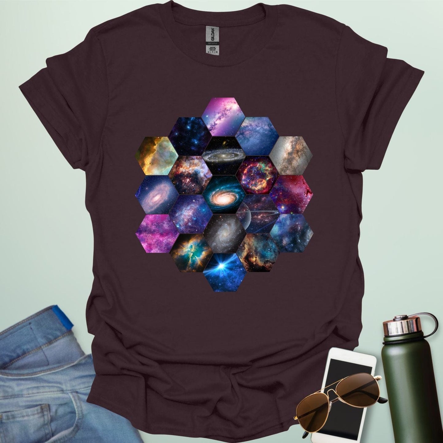 T-shirt design featuring a hexagonal pattern inspired by the James Webb Space Telescope's mirror, each hexagon filled with a different image of the cosmos.