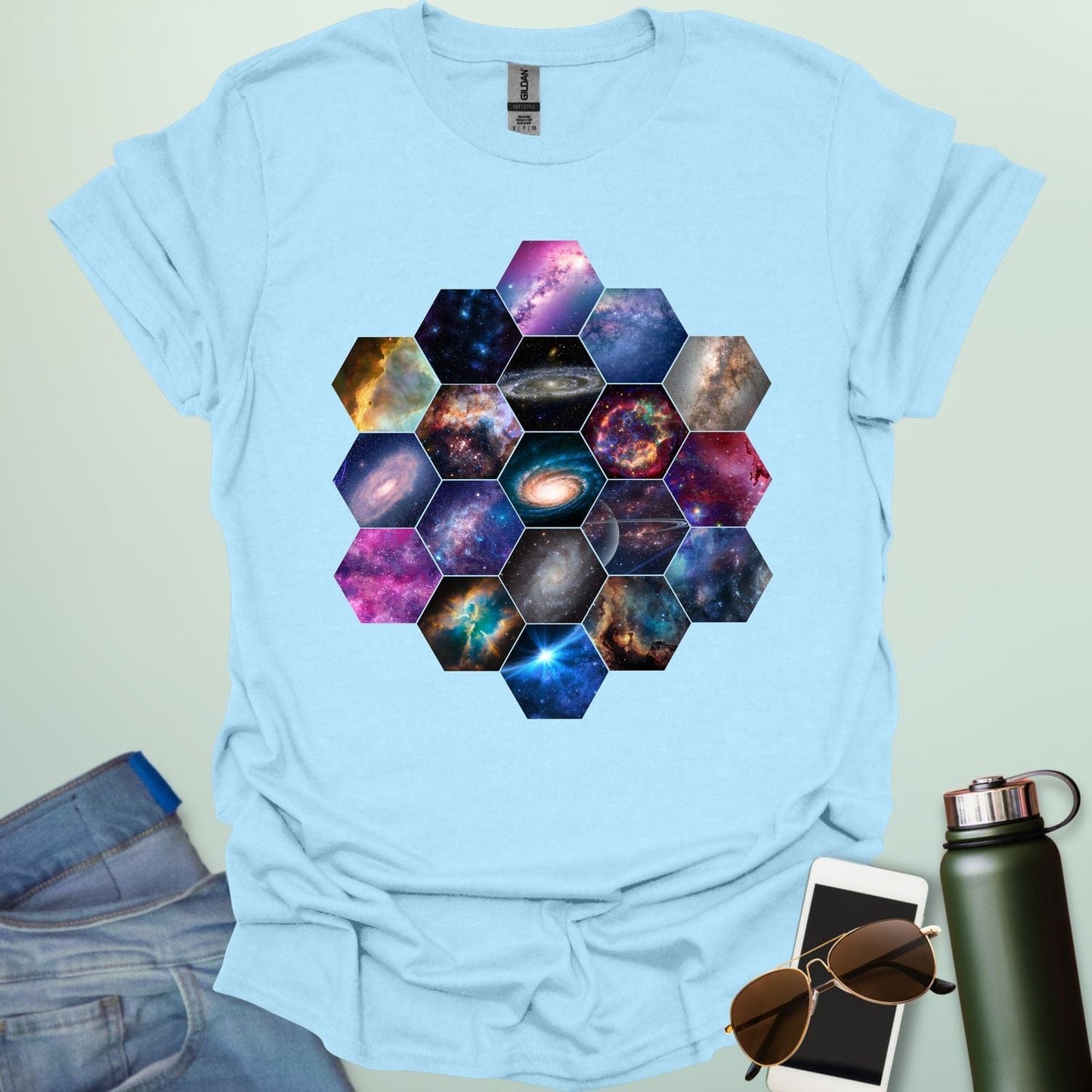 T-shirt design featuring a hexagonal pattern inspired by the James Webb Space Telescope's mirror, each hexagon filled with a different image of the cosmos.