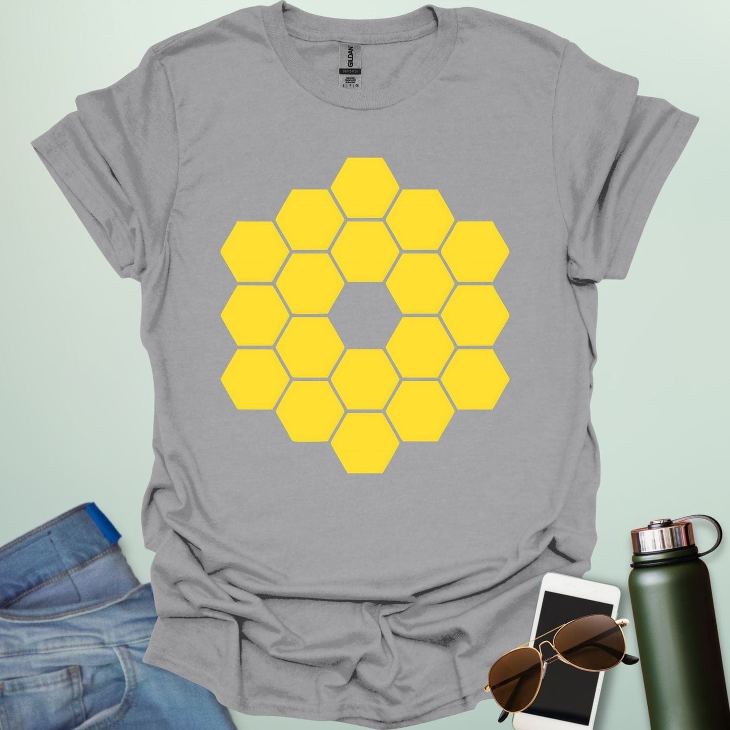 A yellow icon representing the James Webb Space Telescope's hexagonal mirror array.