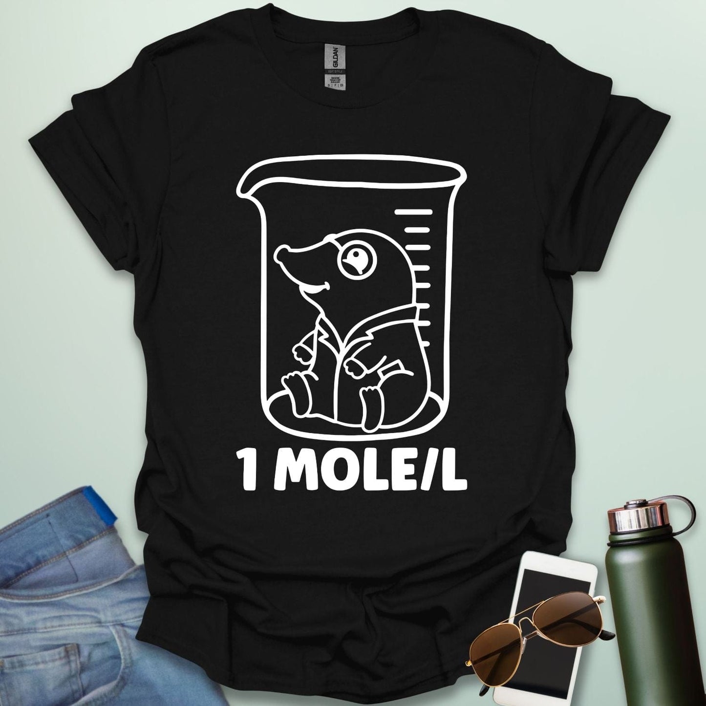 A funny chemistry t-shirt featuring a cartoon mole inside a science beaker. The design includes the text '1 MOLE/L,' a clever pun for chemists and science students.