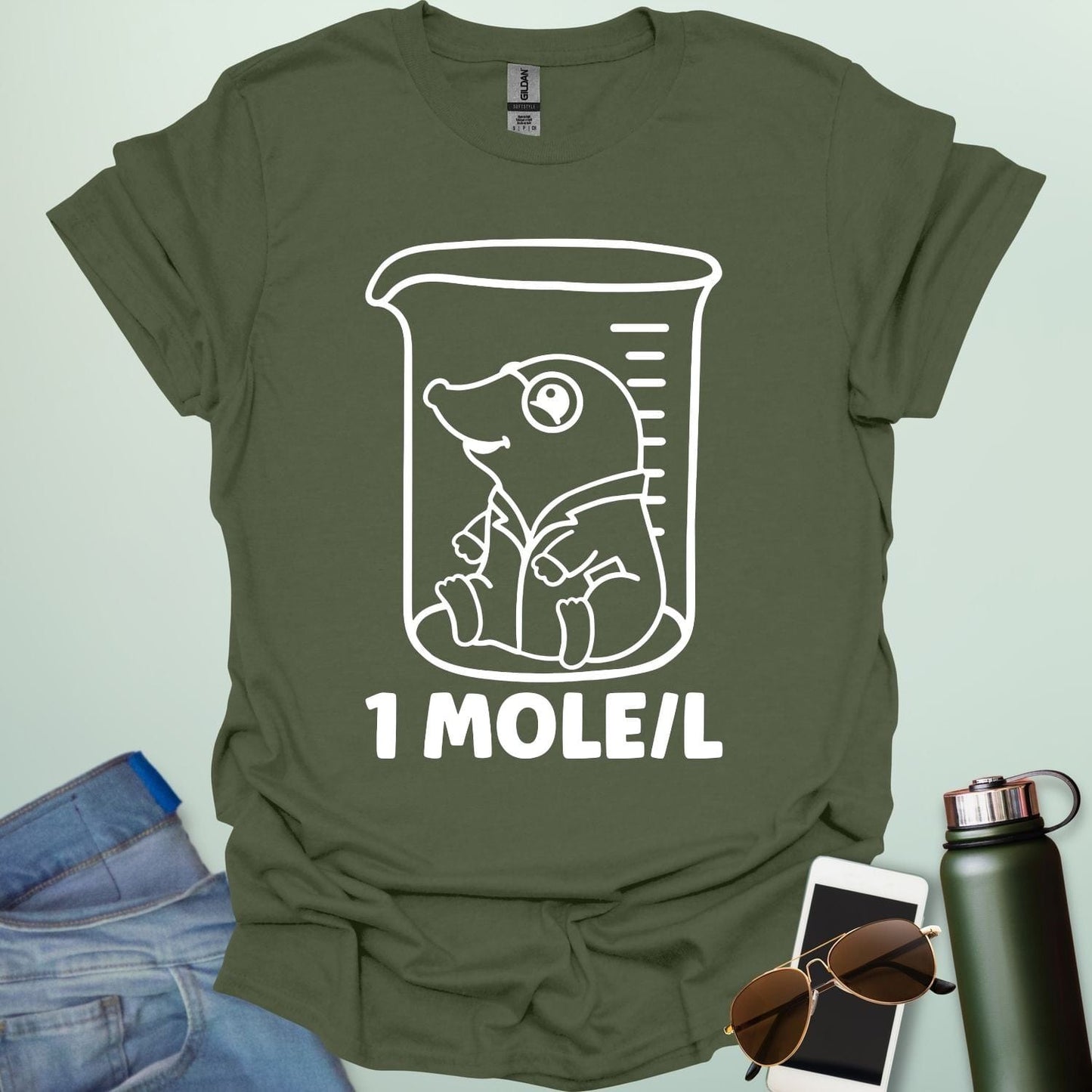 A funny chemistry t-shirt featuring a cartoon mole inside a science beaker. The design includes the text '1 MOLE/L,' a clever pun for chemists and science students.