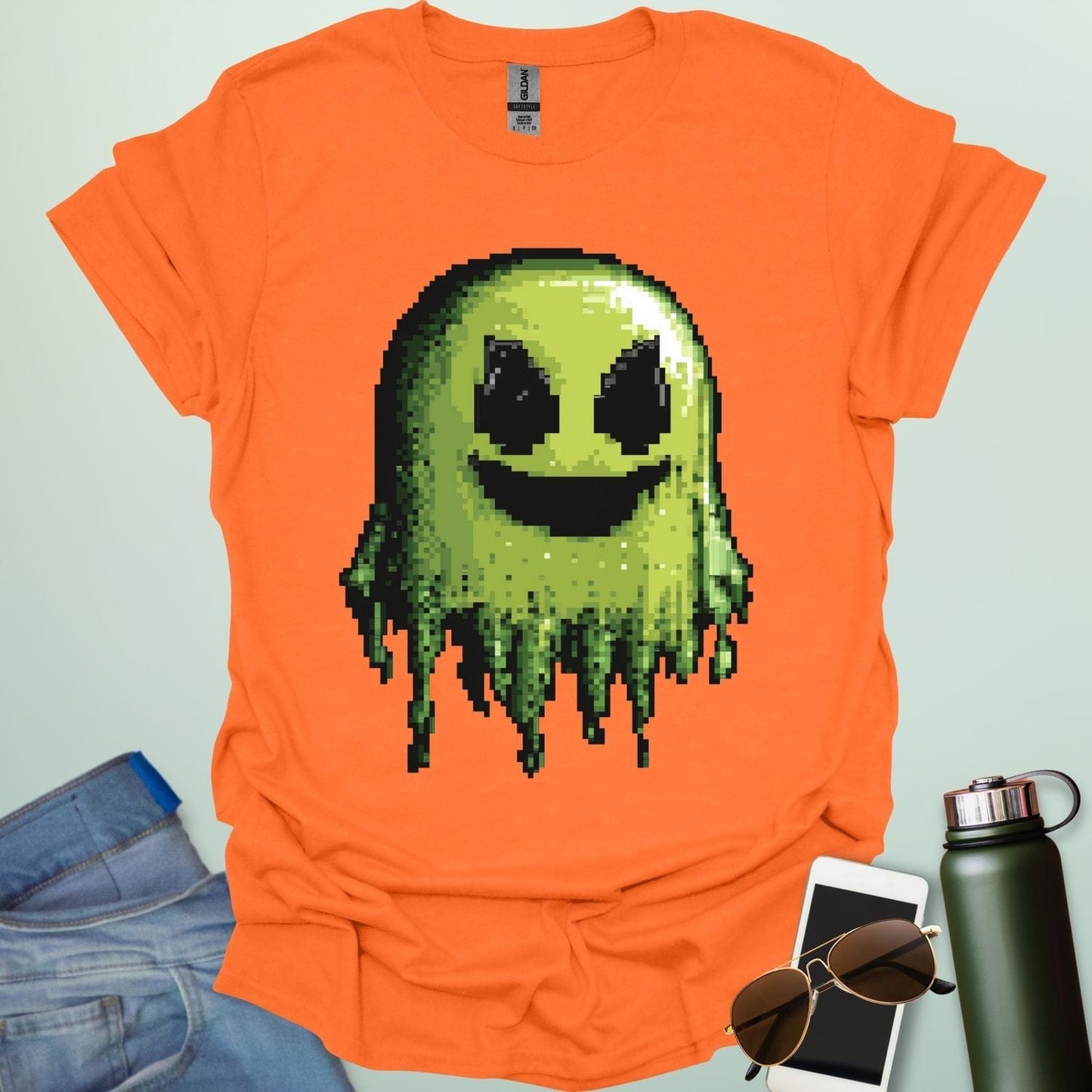Pixel Ghost t-shirt featuring 8-bit style ghost graphic โ a retro video-game inspired design for coders, gamers and lovers of spooky fun.