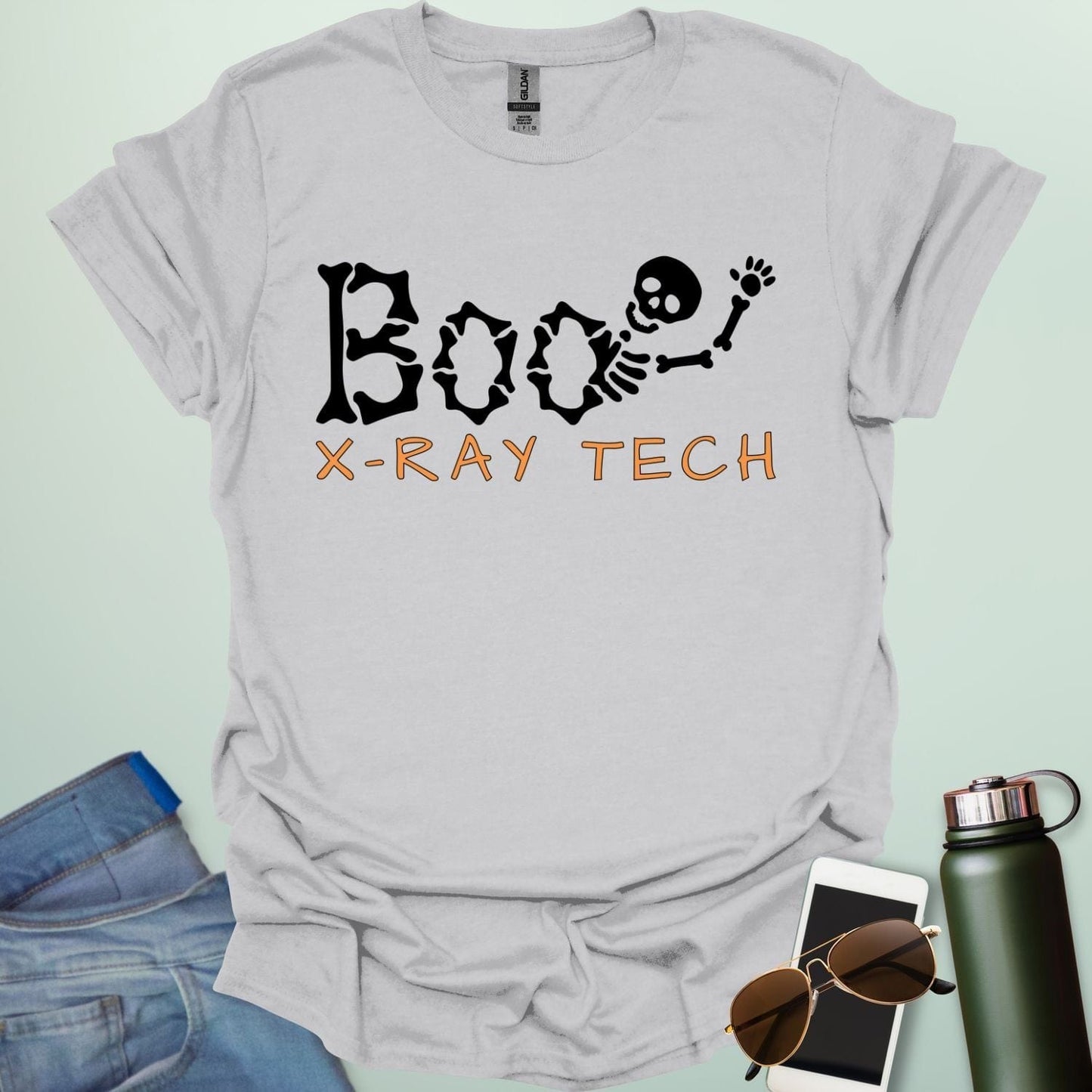 Boo X-Ray Tech t-shirt featuring X-ray imagery and spooky Halloween theme — design for radiology techs and medical imaging fans.
