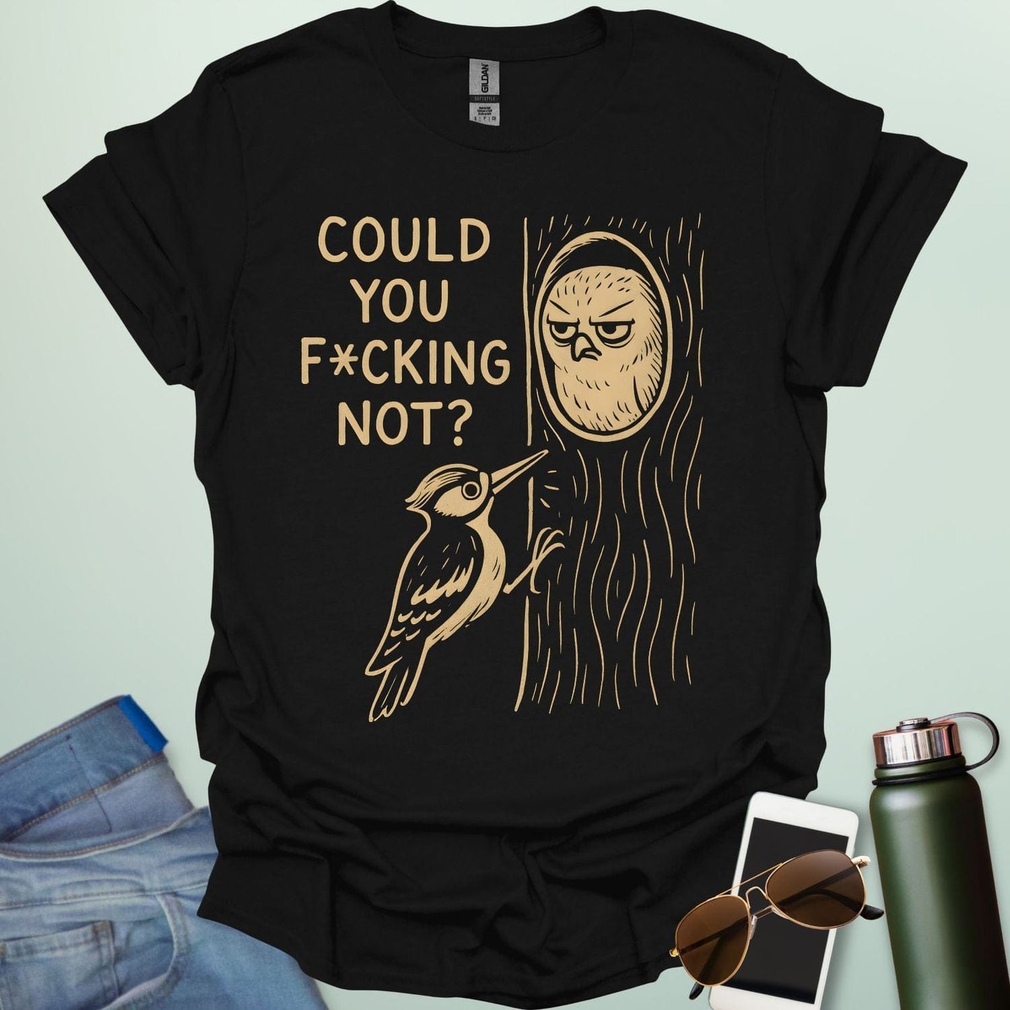 Minimal illustration of an irritated owl peeking from its tree burrow while a woodpecker pecks at the trunk, with bold text reading “COULD YOU F*CKING NOT?” on a dark background.