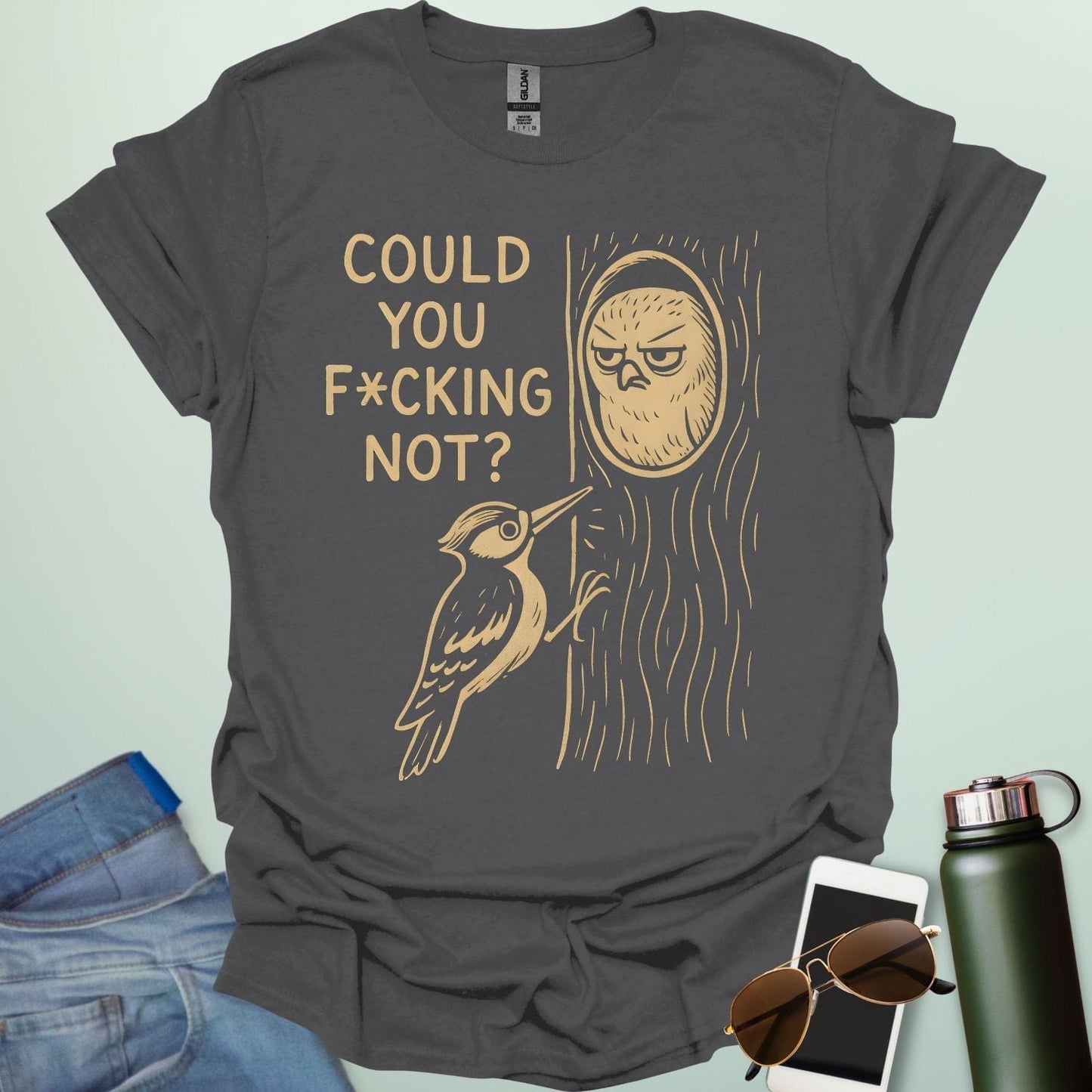 Minimal illustration of an irritated owl peeking from its tree burrow while a woodpecker pecks at the trunk, with bold text reading “COULD YOU F*CKING NOT?” on a dark background.