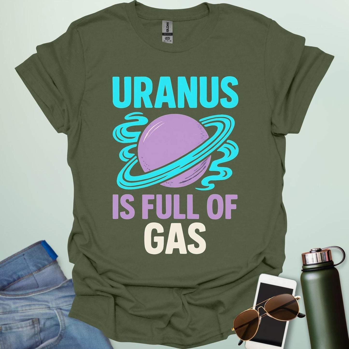 Graphic of the planet Uranus with fun typography reading “Uranus Is Full of Gas” — a humorous astronomy / space pun on a dark background.