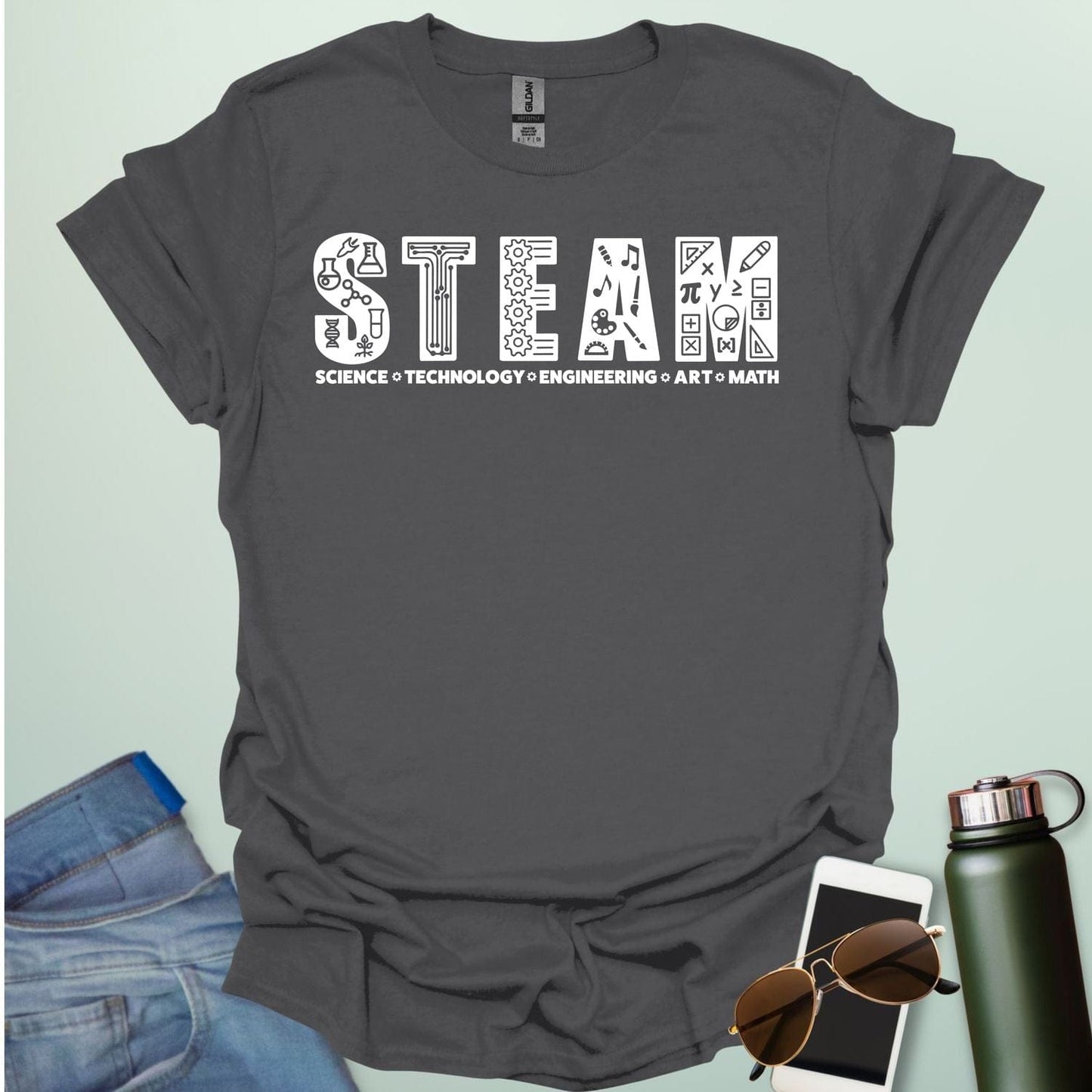 Charcoal gray tee with the word 'STEAM' with each letter filled with related icons, and the words 'SCIENCE TECHNOLOGY ENGINEERING ART MATH' below.