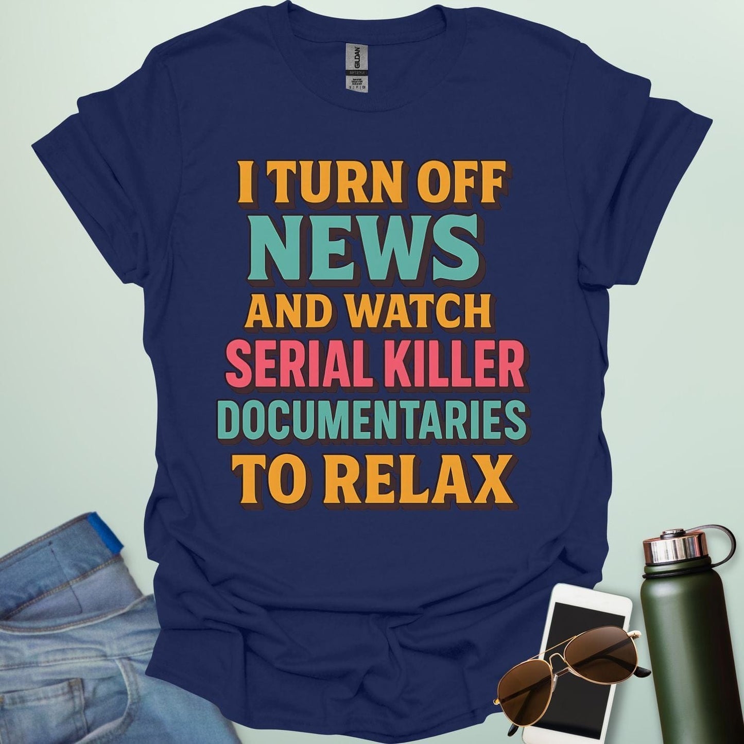 ‘I Turn Off News & Watch Serial Killer Documentaries To Relax’ t-shirt with bold typography — humorous true crime statement tee.