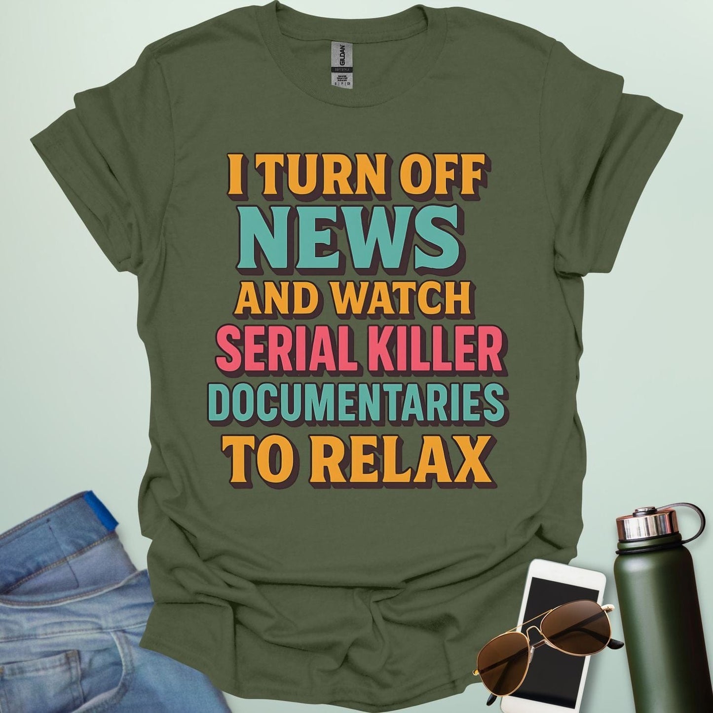 ‘I Turn Off News & Watch Serial Killer Documentaries To Relax’ t-shirt with bold typography — humorous true crime statement tee.