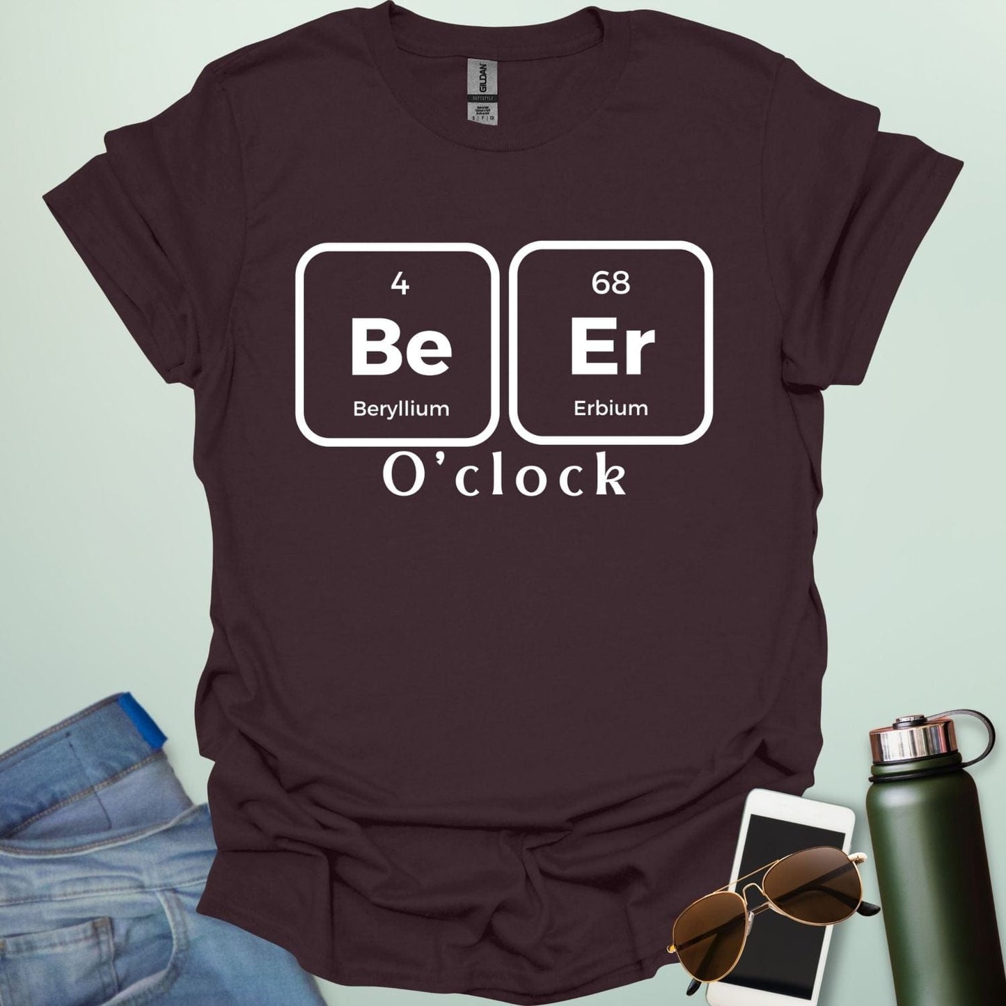 A funny chemistry t-shirt featuring a periodic table pun for 'Beer O'clock' using the elements Beryllium (Be) and Erbium (Er).
