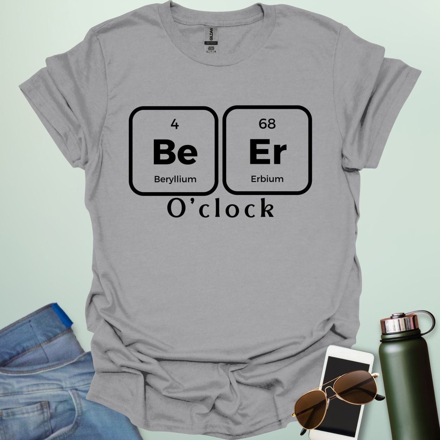 A funny chemistry t-shirt featuring a periodic table pun for 'Beer O'clock' using the elements Beryllium (Be) and Erbium (Er).
