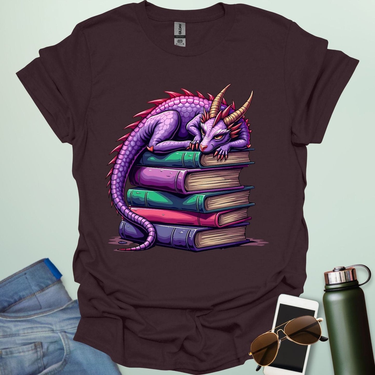 Dragon Fantasy t-shirt featuring whimsical purple dragon curled on a stack of books β perfect for fantasy fans, book lovers, and story geeks.