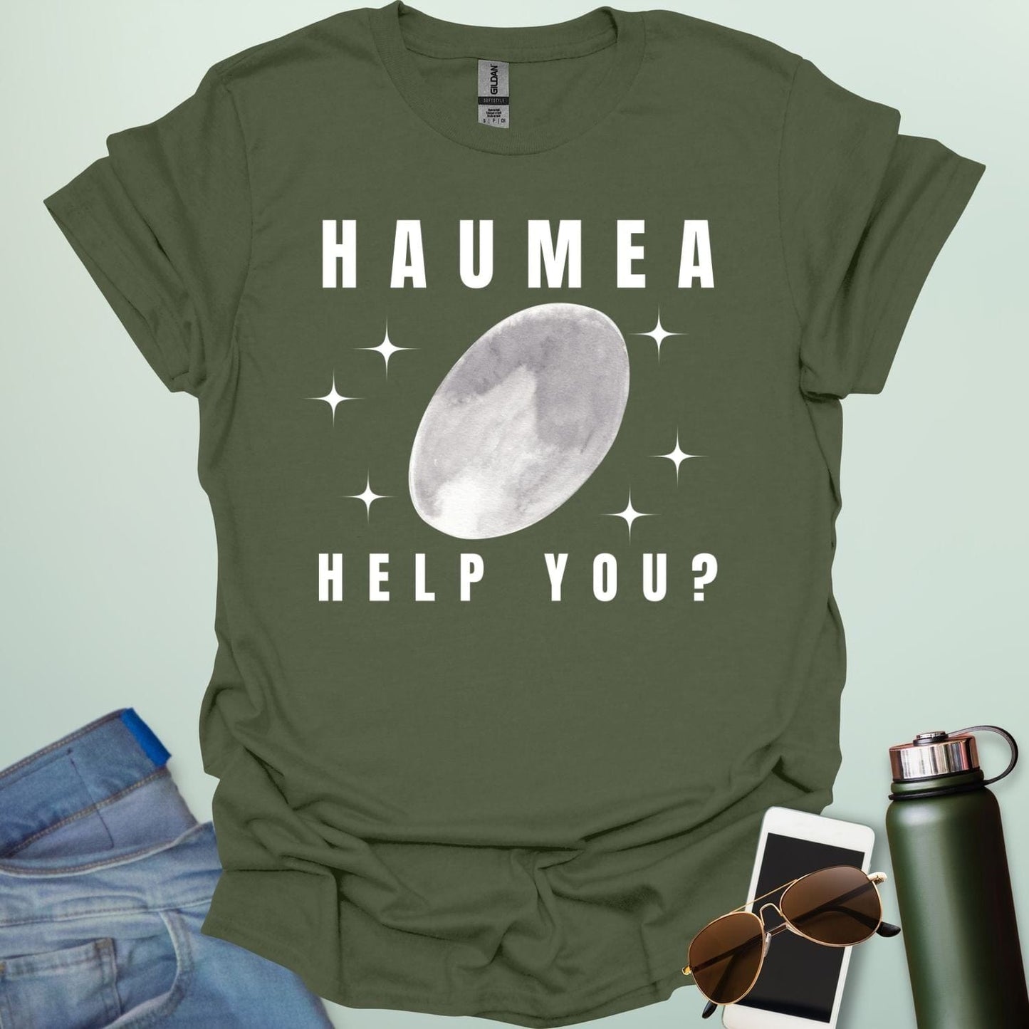 "A military green t-shirt with a drawing of the dwarf planet Haumea and the text 'HAUMEA HELP YOU?'
