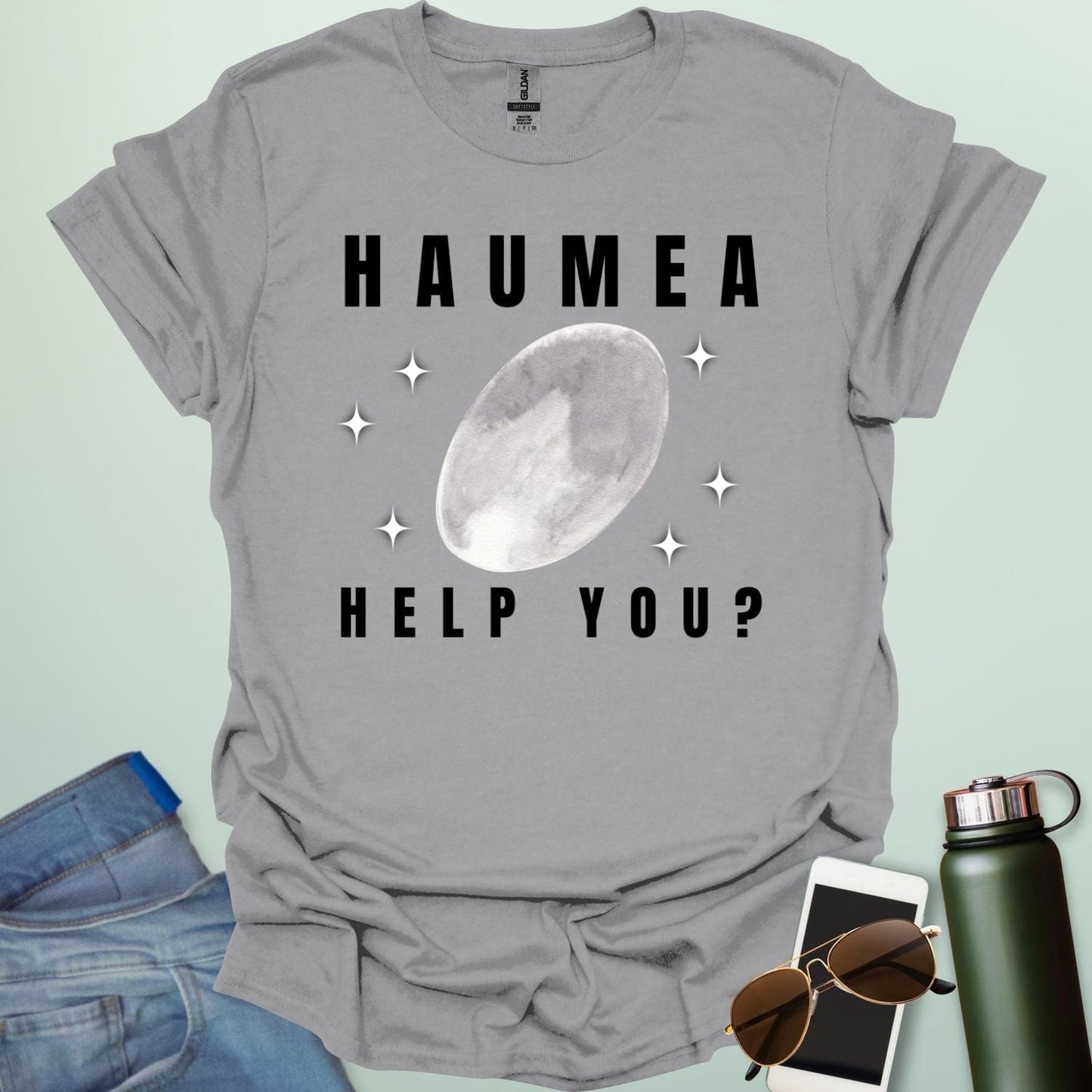 "A sport grey t-shirt with a drawing of the dwarf planet Haumea and the text 'HAUMEA HELP YOU?'