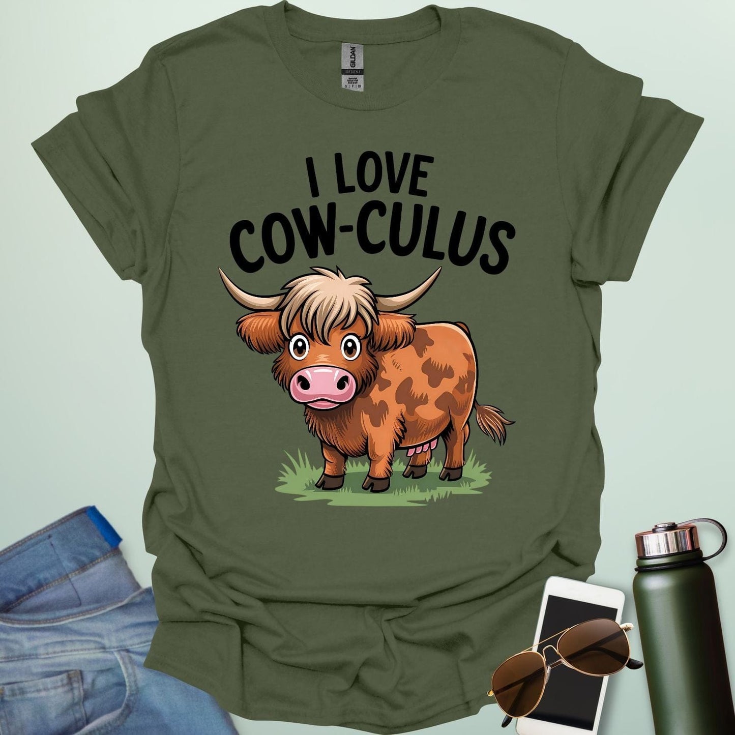 A cute and funny t-shirt featuring a highland cow in a field of flowers and the text 'I Love Cow-culus,' a perfect gift for math teachers and students.