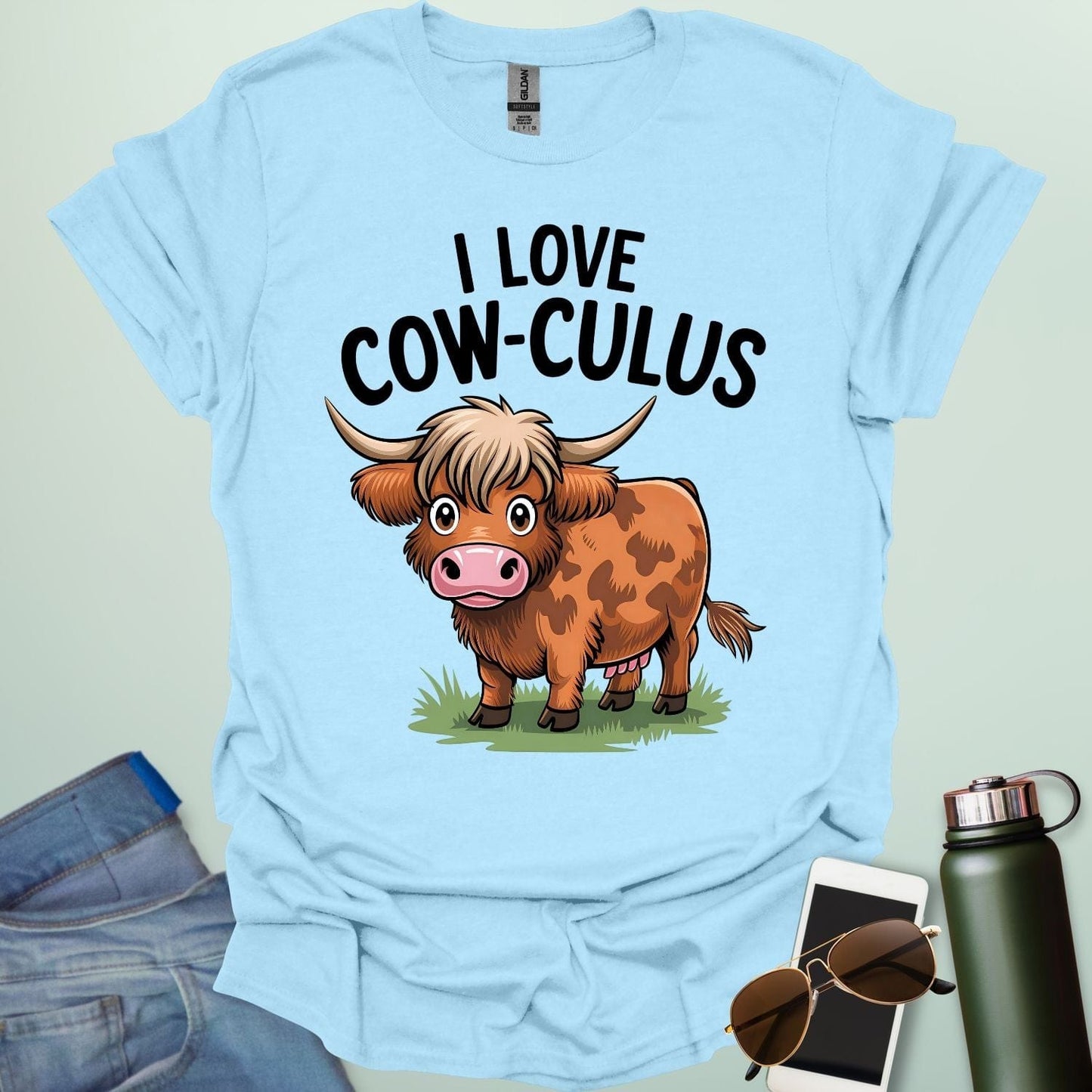 A cute and funny t-shirt featuring a highland cow in a field of flowers and the text 'I Love Cow-culus,' a perfect gift for math teachers and students.