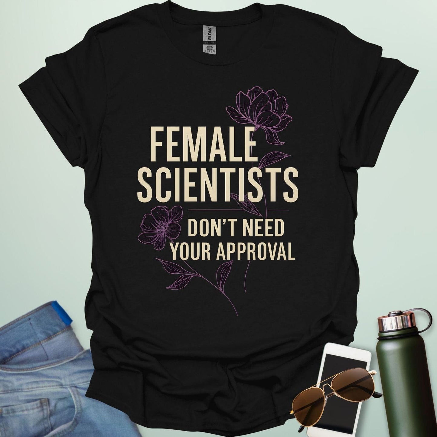 ‘Female Scientists Don’t Need Your Approval’ t-shirt with bold typography — feminist STEM apparel celebrating confident women in science.