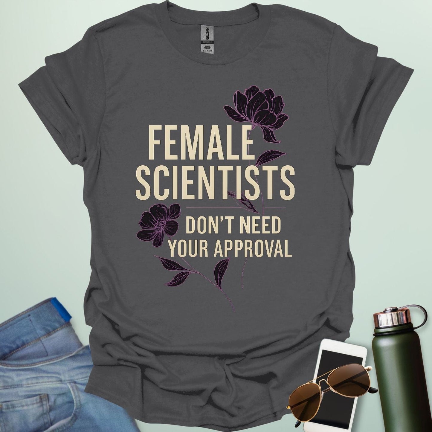 ‘Female Scientists Don’t Need Your Approval’ t-shirt with bold typography — feminist STEM apparel celebrating confident women in science.