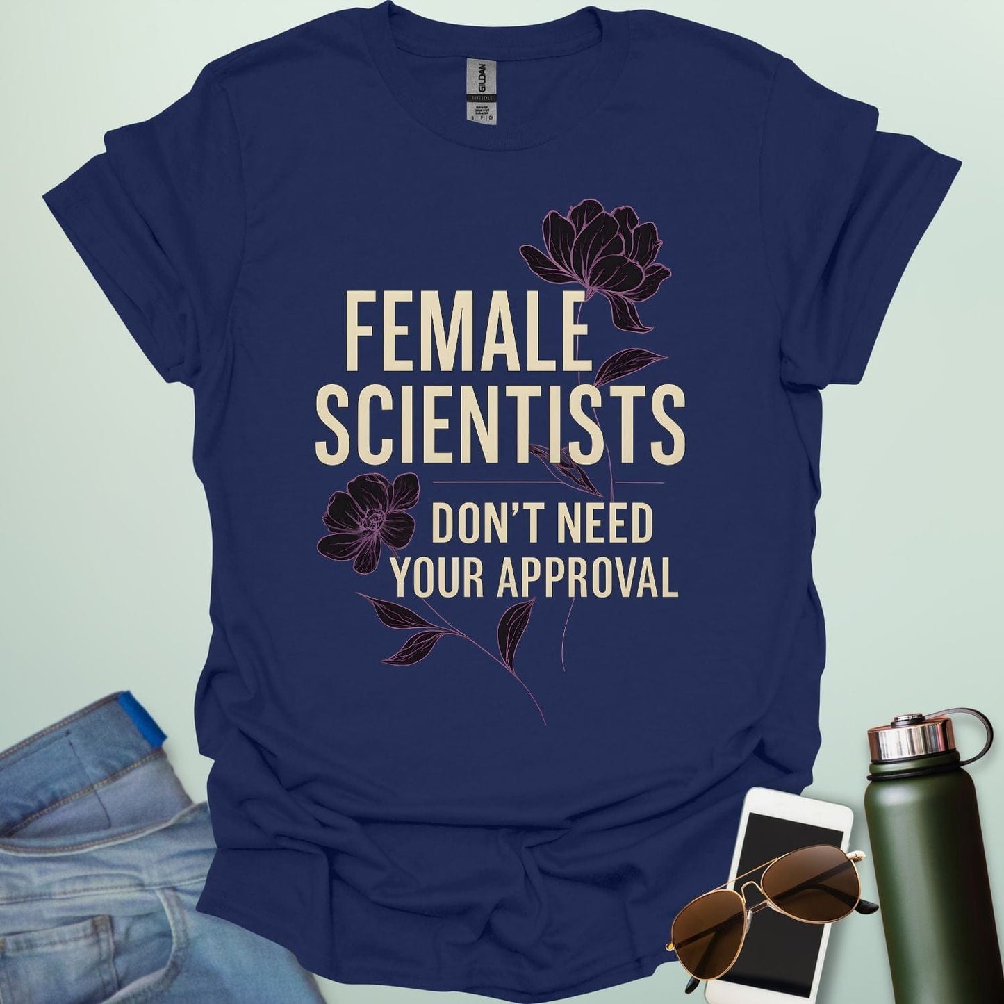‘Female Scientists Don’t Need Your Approval’ t-shirt with bold typography — feminist STEM apparel celebrating confident women in science.
