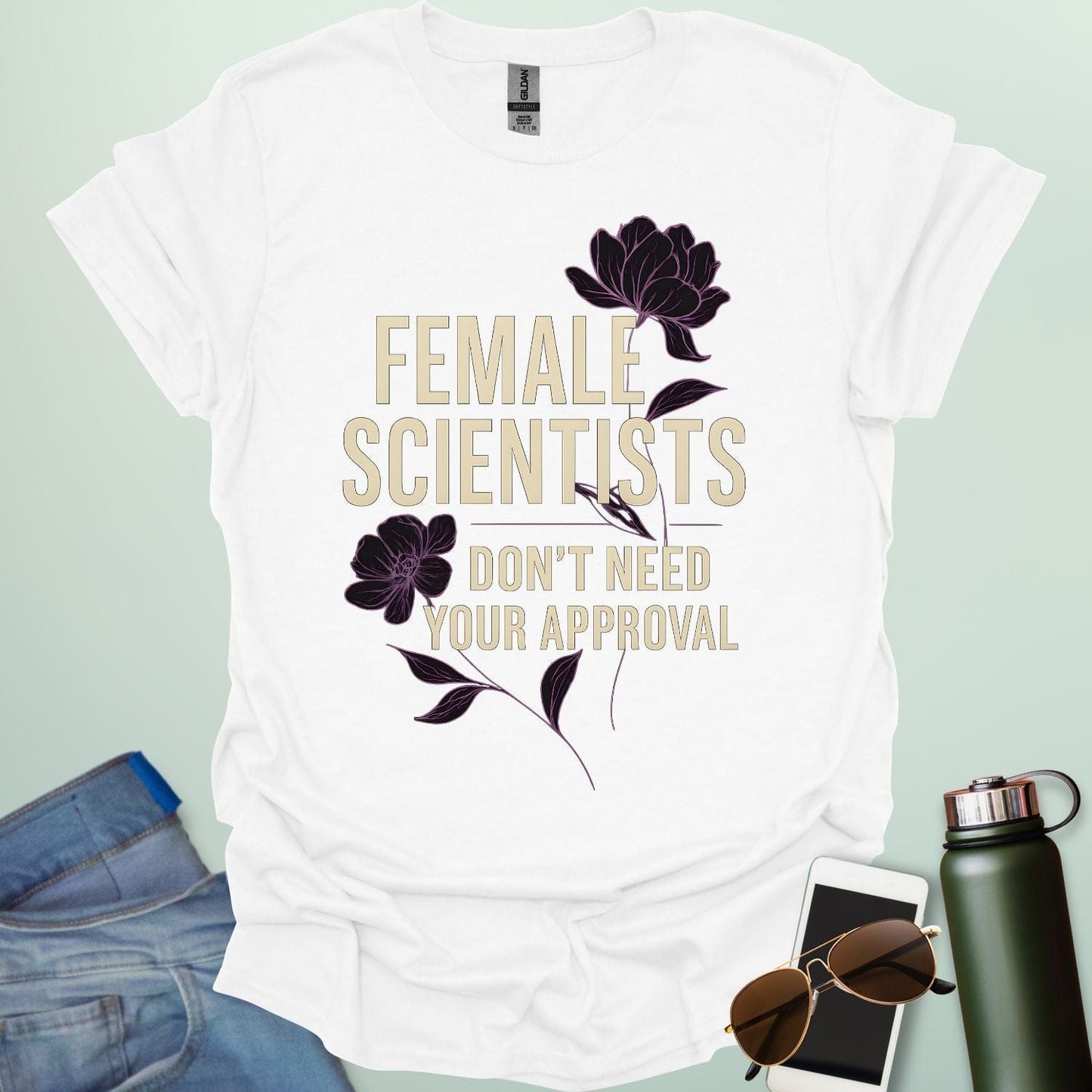 ‘Female Scientists Don’t Need Your Approval’ t-shirt with bold typography — feminist STEM apparel celebrating confident women in science.