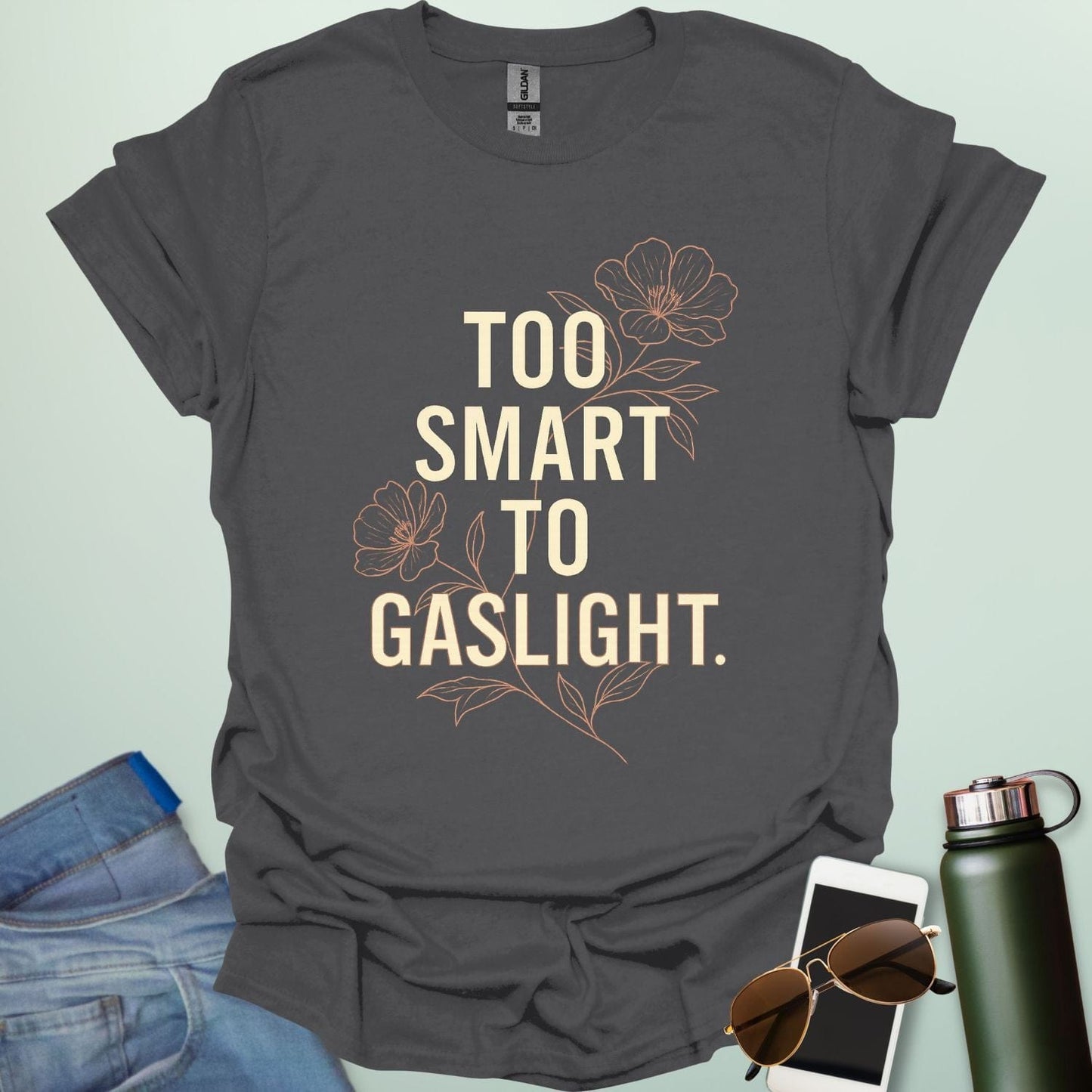 ‘Too Smart to Gaslight’ t-shirt with bold typography — statement tee for thinkers and mental health advocates.