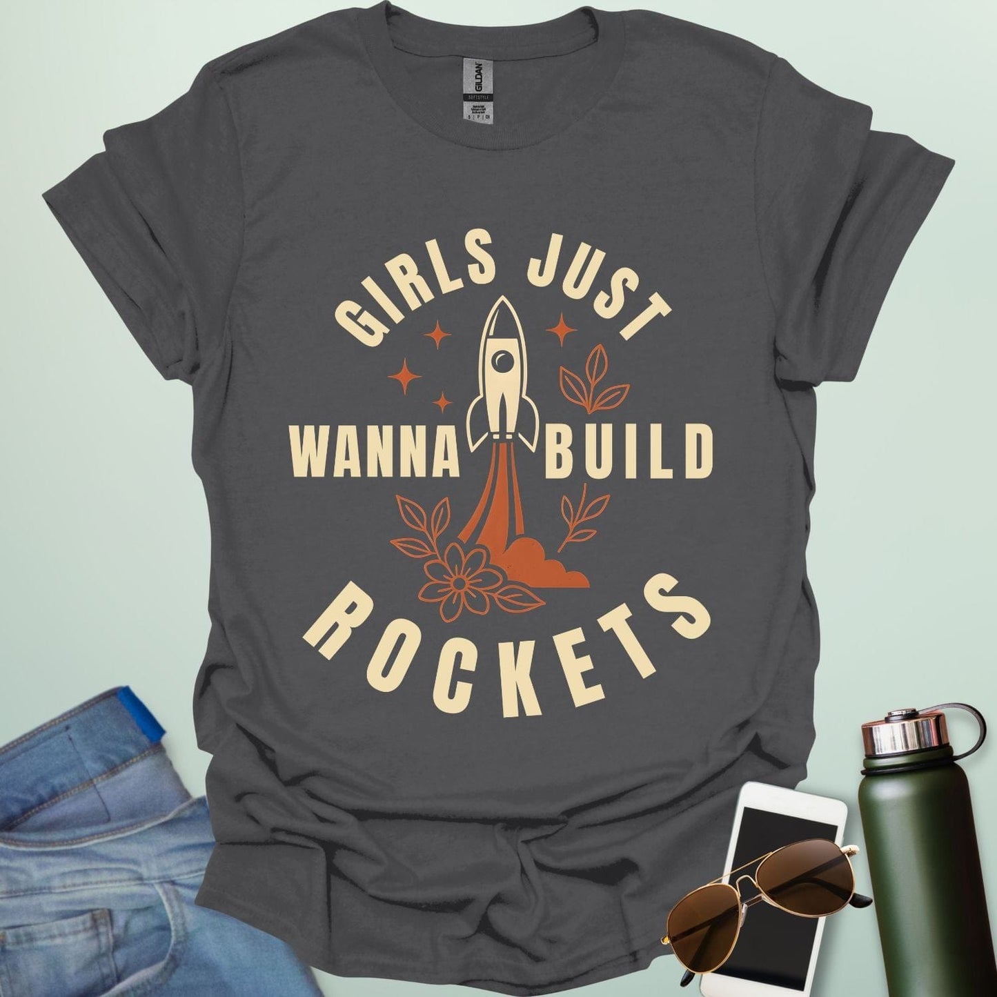 ‘Girls Just Wanna Build Rockets’ t-shirt with rocket illustration — STEM apparel for girls in engineering and space lovers.