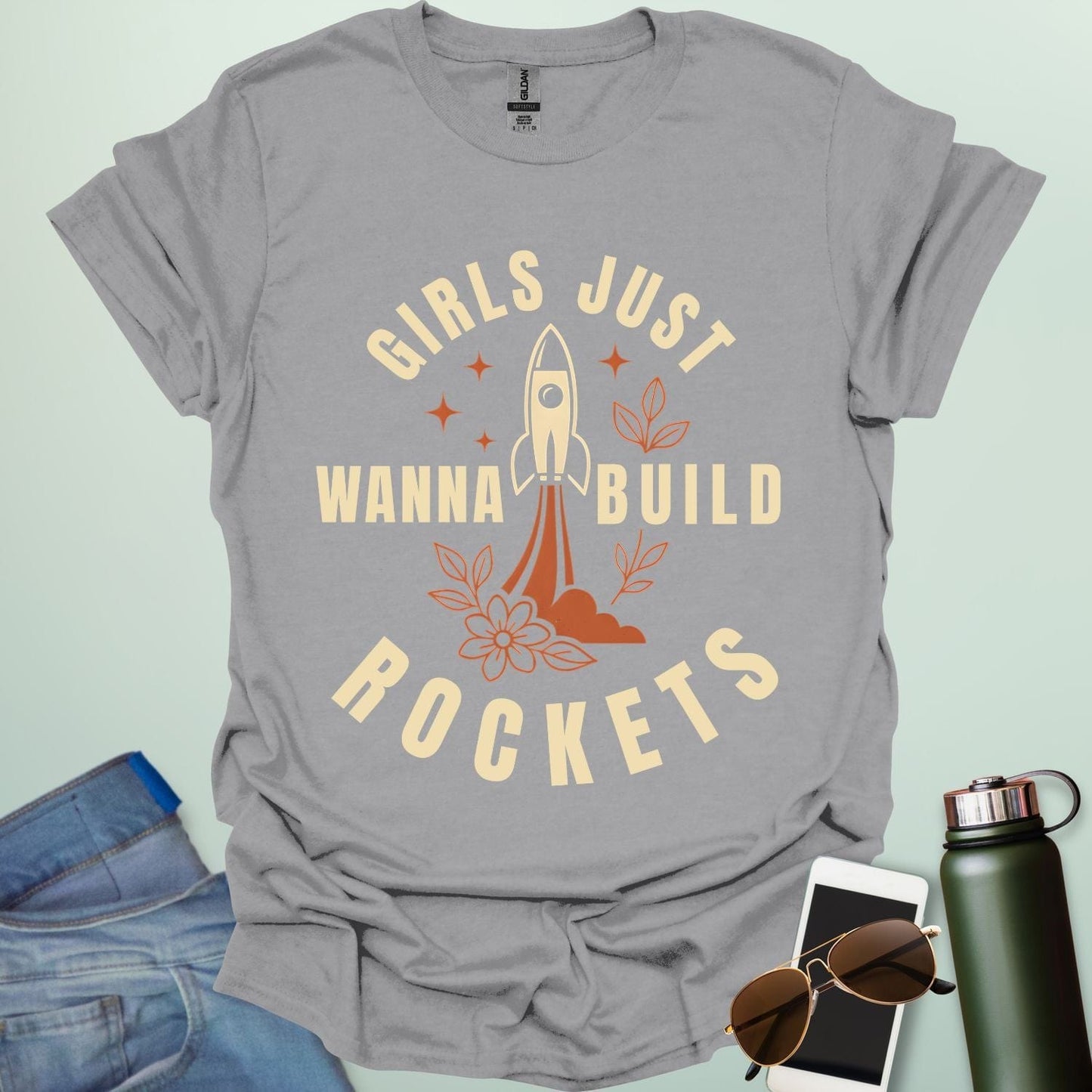 ‘Girls Just Wanna Build Rockets’ t-shirt with rocket illustration — STEM apparel for girls in engineering and space lovers.