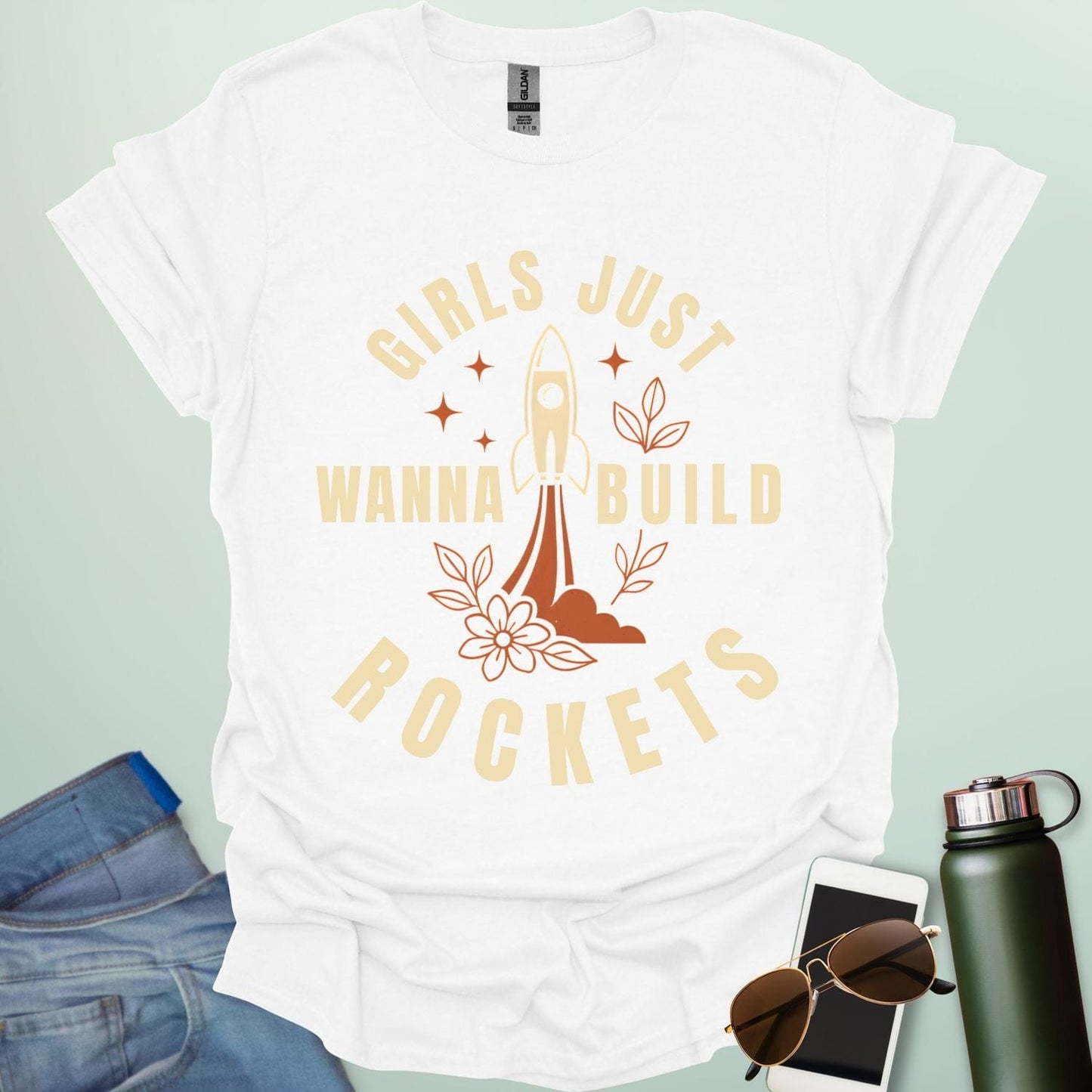 ‘Girls Just Wanna Build Rockets’ t-shirt with rocket illustration — STEM apparel for girls in engineering and space lovers.