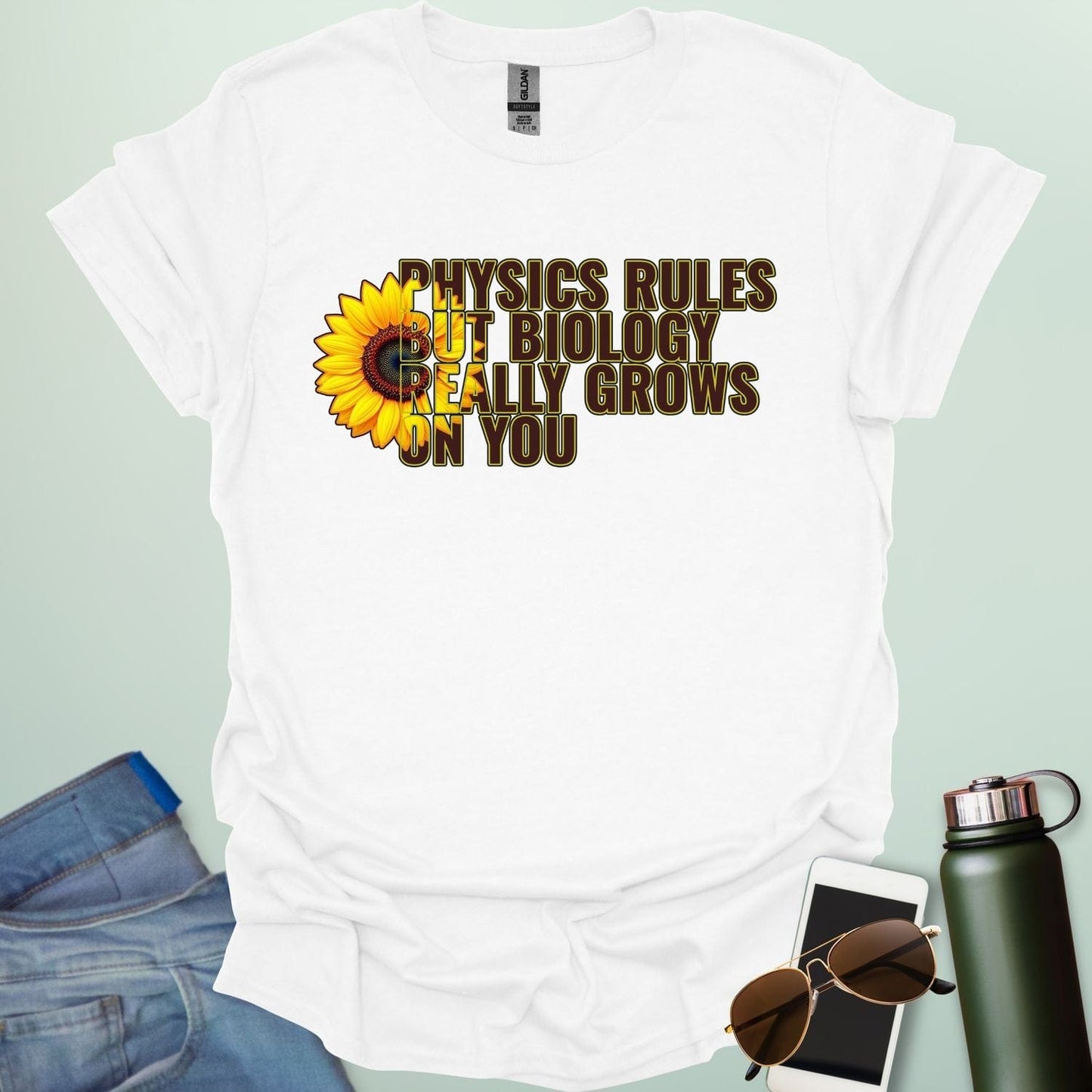 A funny biology t-shirt with a sunflower and the text 'Biology Really Grows On You,' a witty pun for biology teachers and plant lovers.