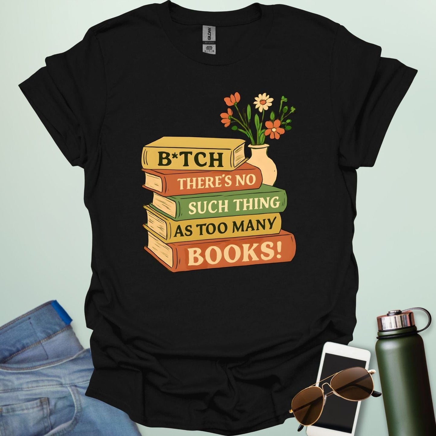 For readers with attitude — this bold “B*tch, There’s No Such Thing As Too Many Books” tee celebrates your love of literature with unapologetic wit.