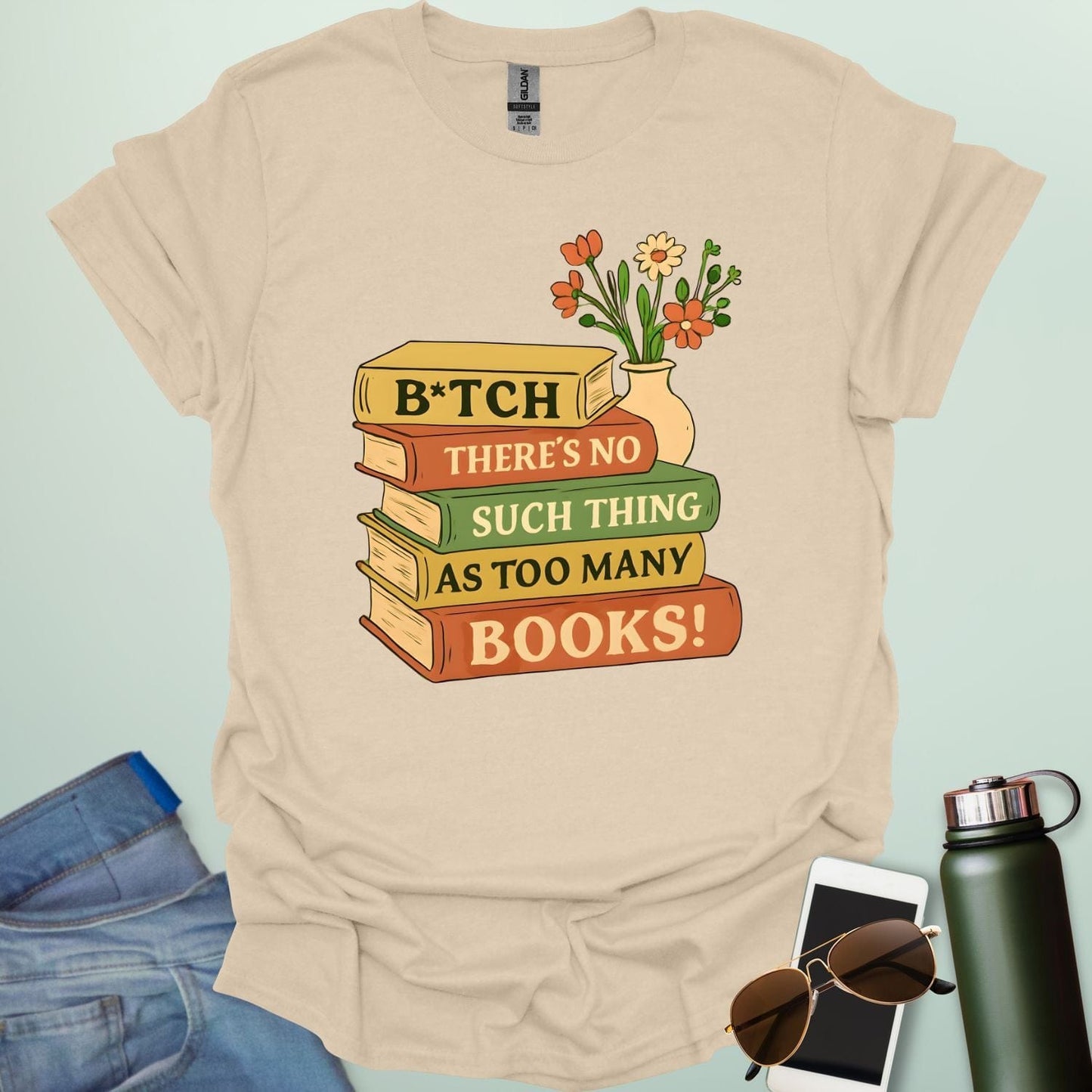 For readers with attitude — this bold “B*tch, There’s No Such Thing As Too Many Books” tee celebrates your love of literature with unapologetic wit.