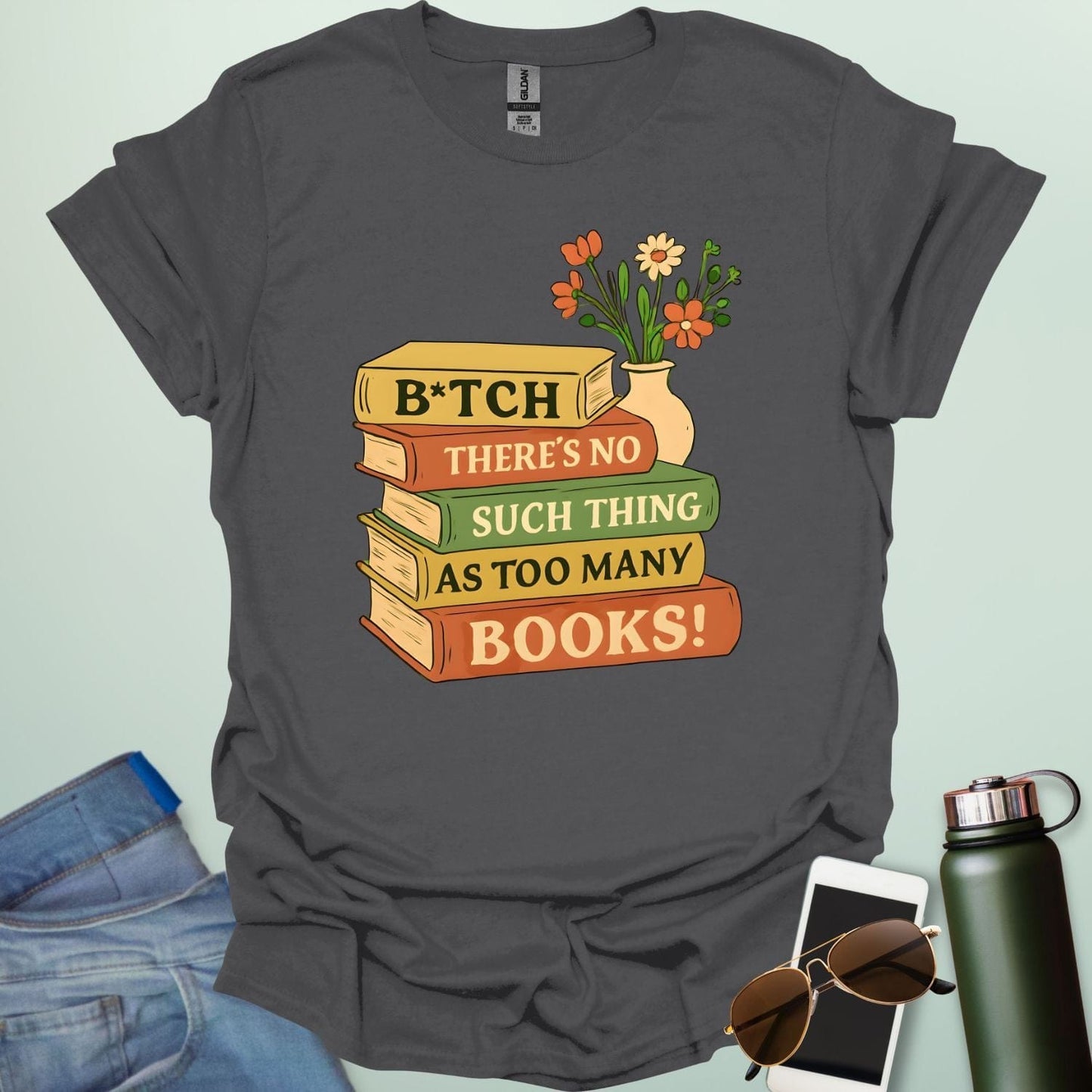 For readers with attitude — this bold “B*tch, There’s No Such Thing As Too Many Books” tee celebrates your love of literature with unapologetic wit.