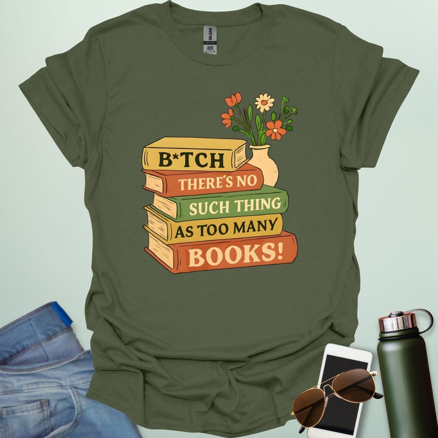 For readers with attitude — this bold “B*tch, There’s No Such Thing As Too Many Books” tee celebrates your love of literature with unapologetic wit.