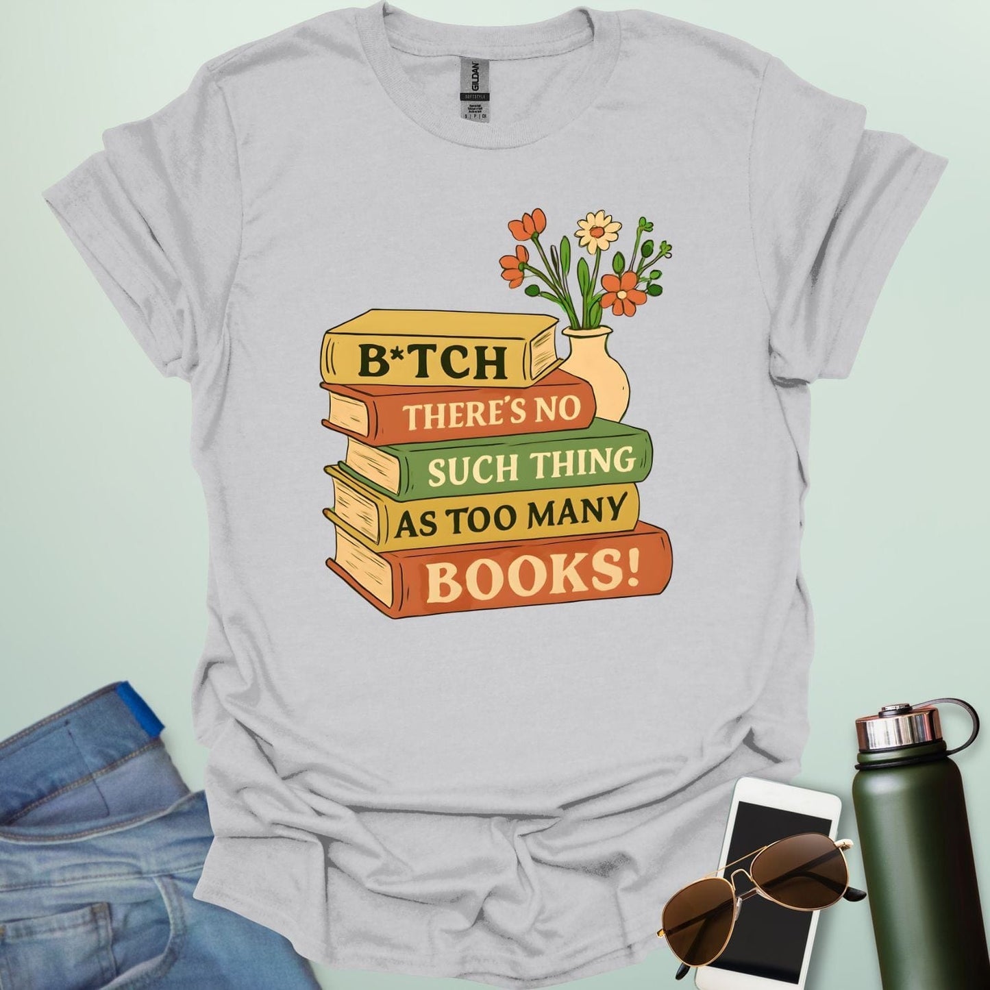 For readers with attitude — this bold “B*tch, There’s No Such Thing As Too Many Books” tee celebrates your love of literature with unapologetic wit.