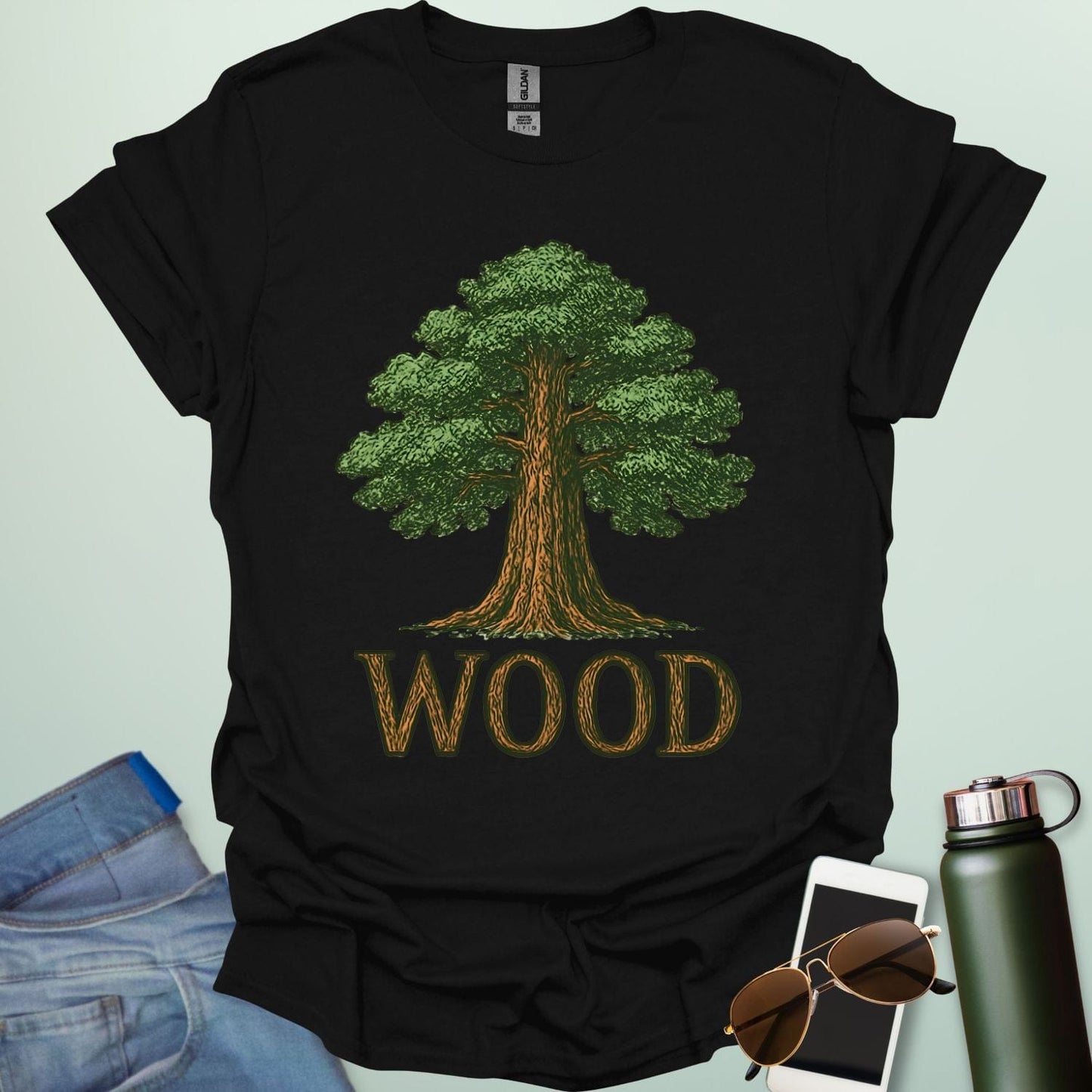 Wood tee with stylized tree / nature motif — perfect for fans of forests, national parks & Taylor Swift.