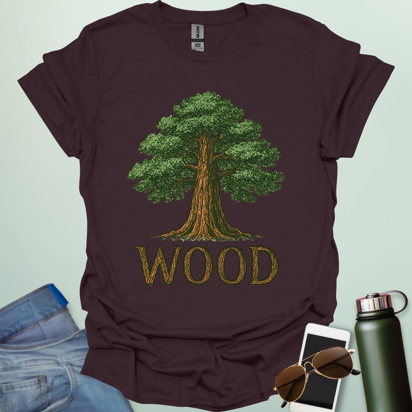 Wood tee with stylized tree / nature motif — perfect for fans of forests, national parks & Taylor Swift.